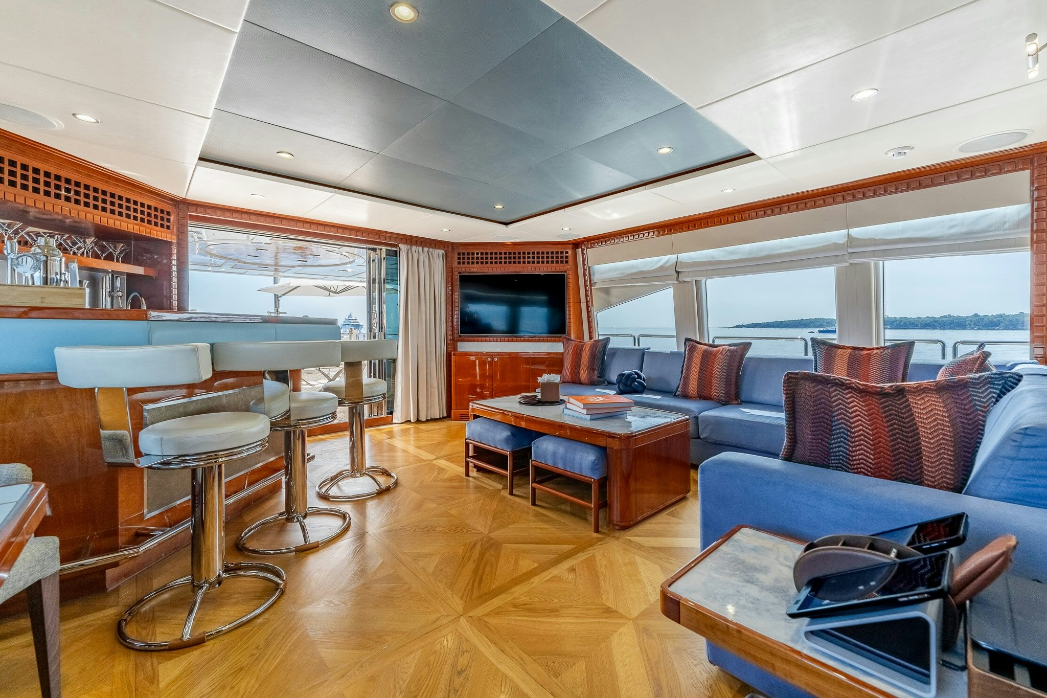 a living room with a wood floor aboard GRAND CRU Yacht for Sale