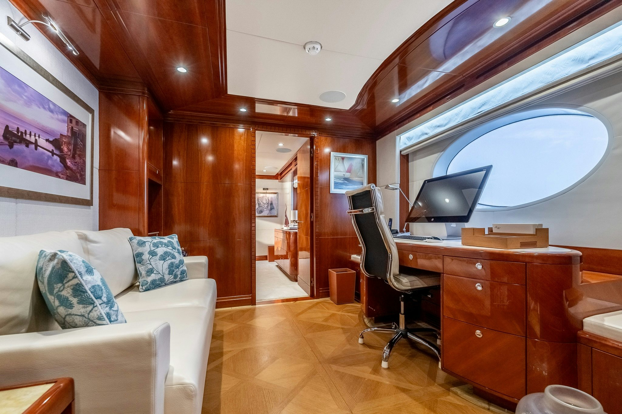 a room with a desk and a chair aboard GRAND CRU Yacht for Sale