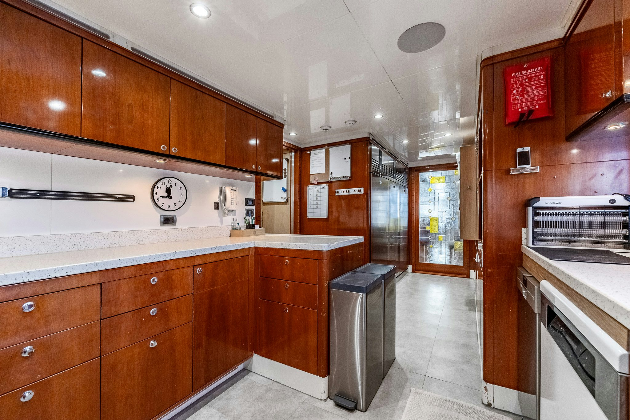 a kitchen with wooden cabinets aboard GRAND CRU Yacht for Sale