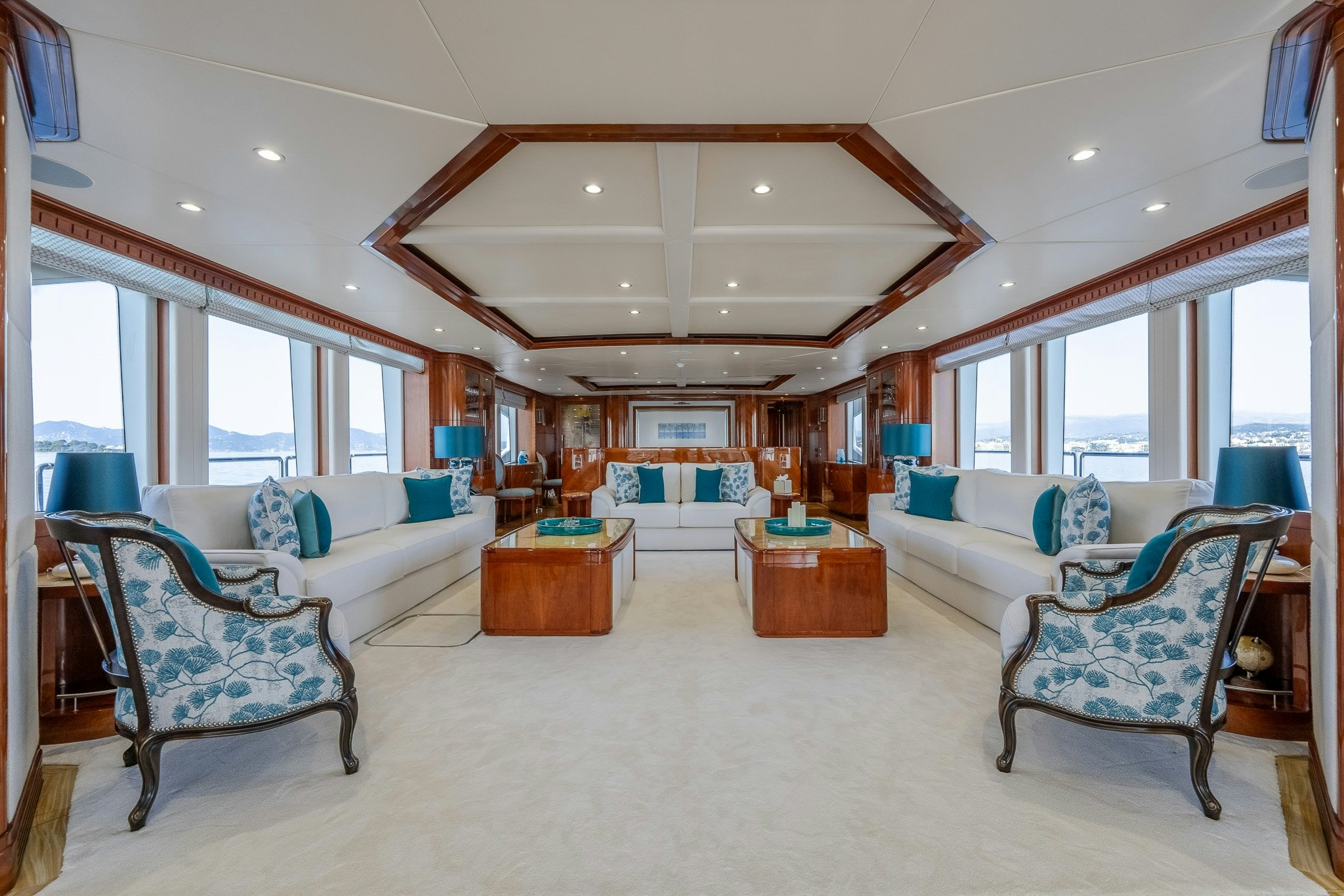 a living room with a large window aboard GRAND CRU Yacht for Sale