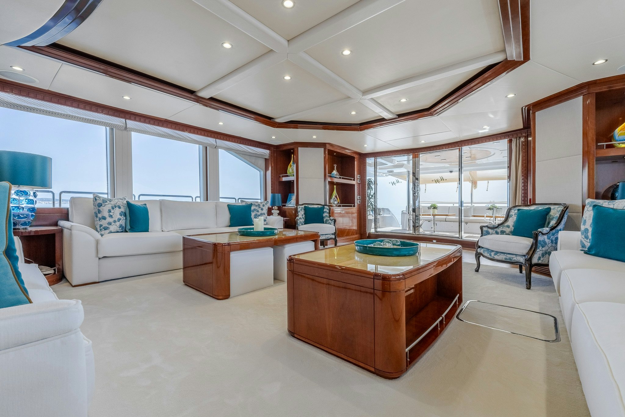 a living room with a table and chairs aboard GRAND CRU Yacht for Sale