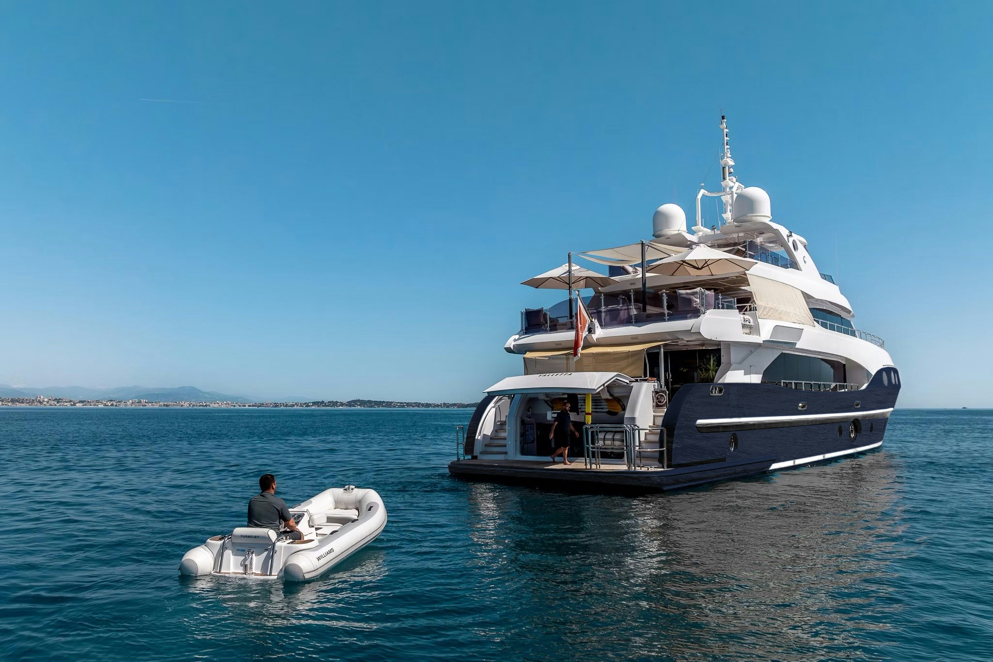 a boat with a motor boat on it aboard GRAND CRU Yacht for Charter
