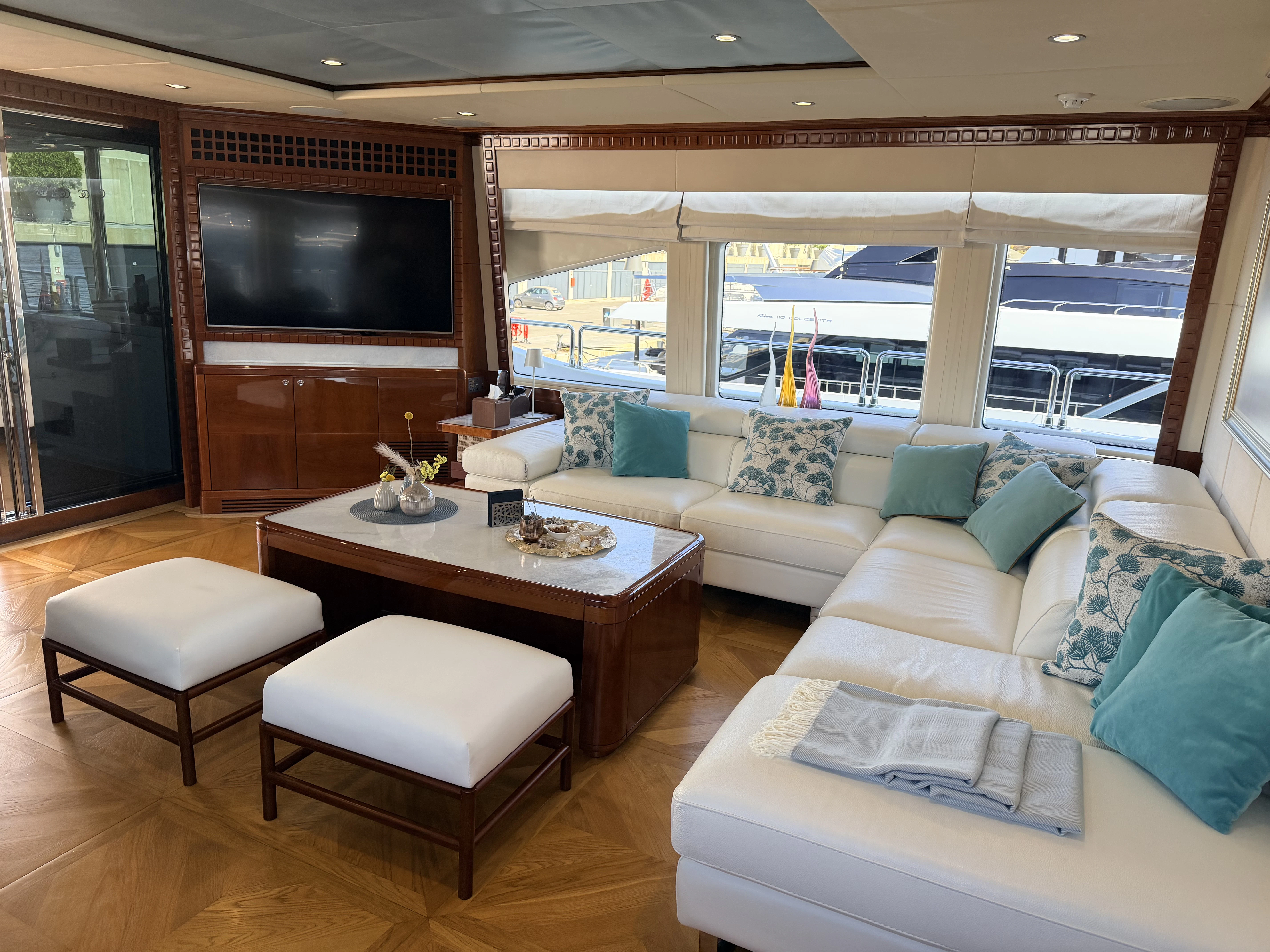 a living room with a large television aboard GRAND CRU Yacht for Charter