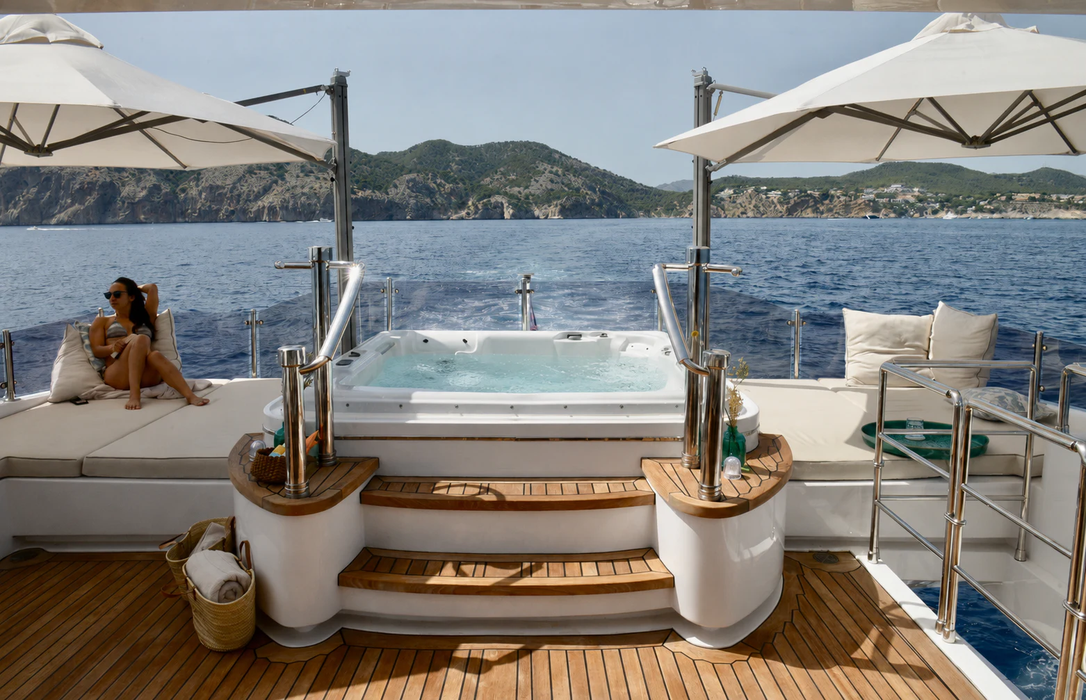 a person sitting on a boat aboard GRAND CRU Yacht for Charter