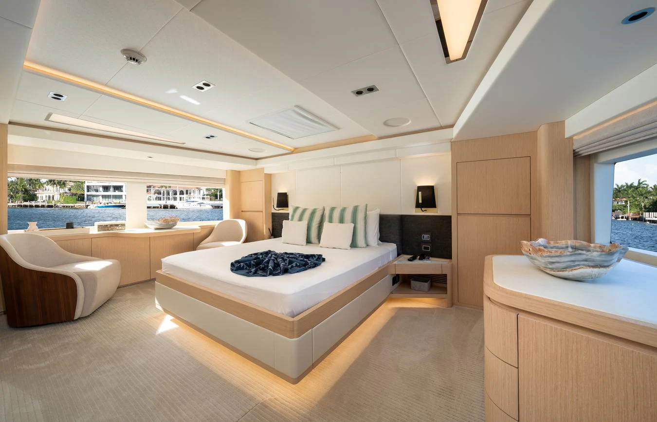 a large modern bedroom with a large balcony aboard GOLD STAR Yacht for Charter