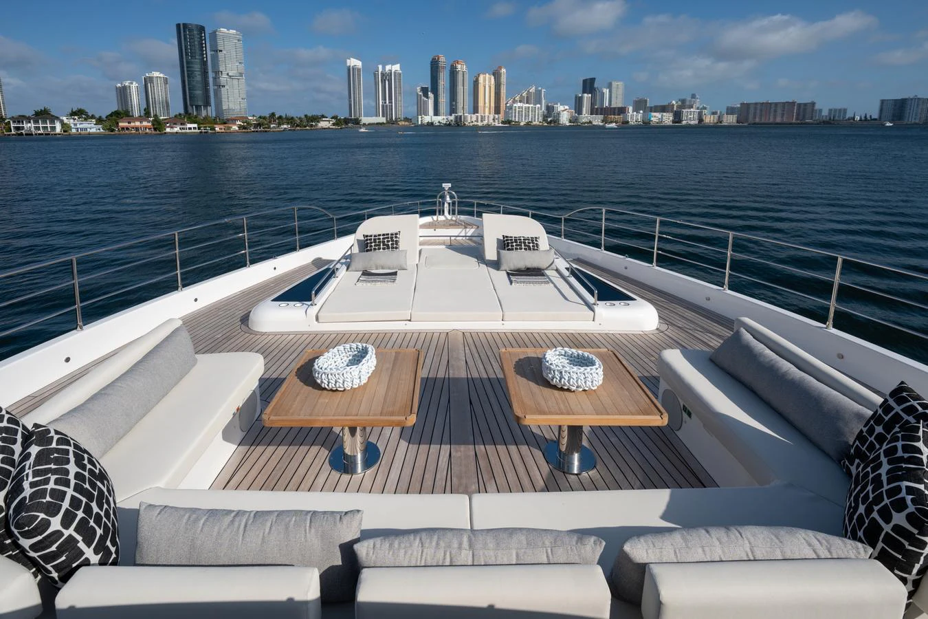 a deck overlooking a city aboard GOLD STAR Yacht for Charter