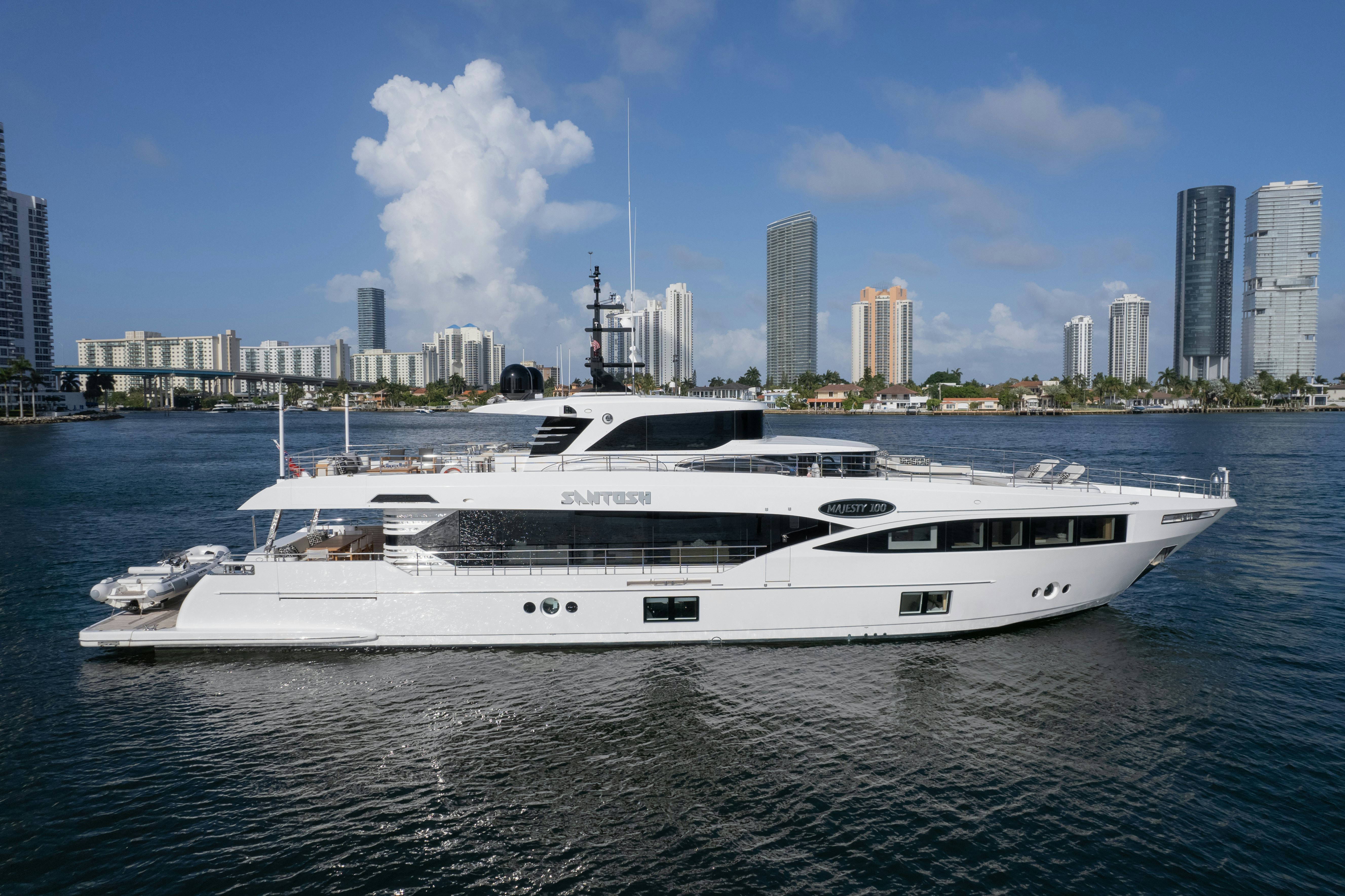 a white yacht in the water aboard SANTOSH Yacht for Sale