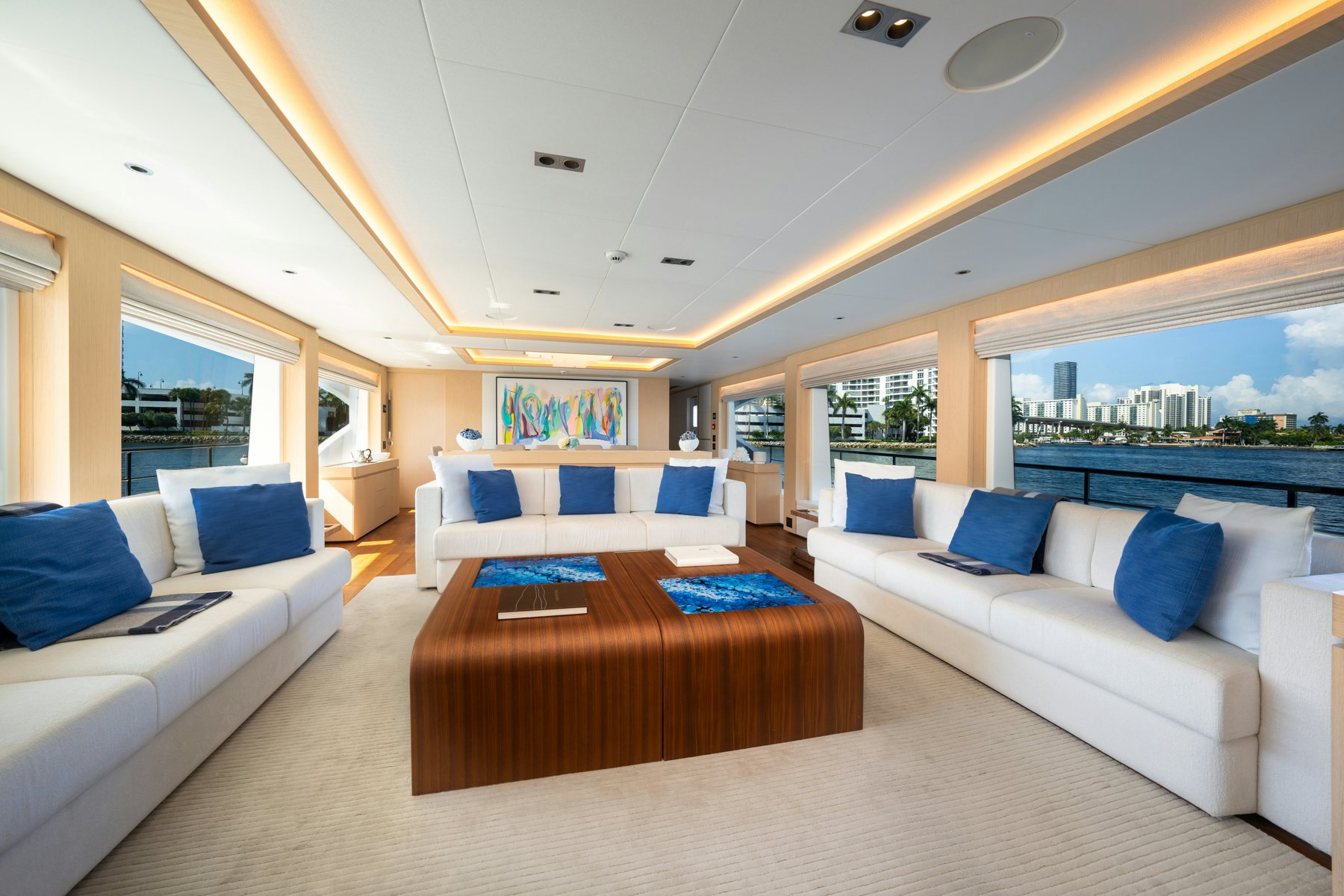 a living room with a couch and a table aboard SANTOSH Yacht for Sale