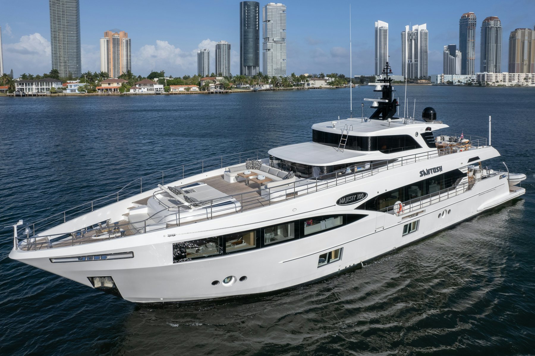 a large white yacht in the water aboard SANTOSH Yacht for Sale