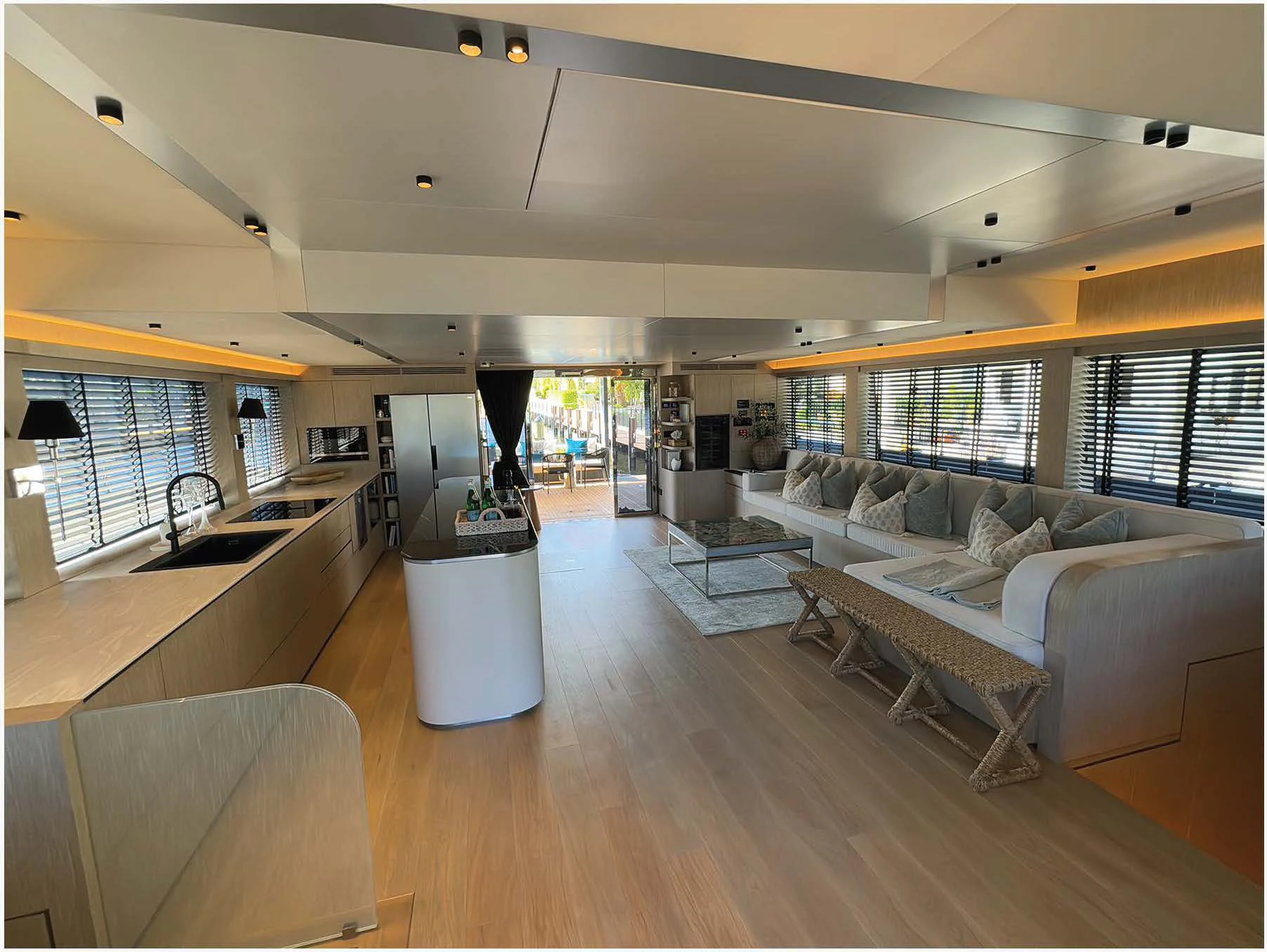 a large living room with a large window aboard FLAGSHIP Yacht for Sale