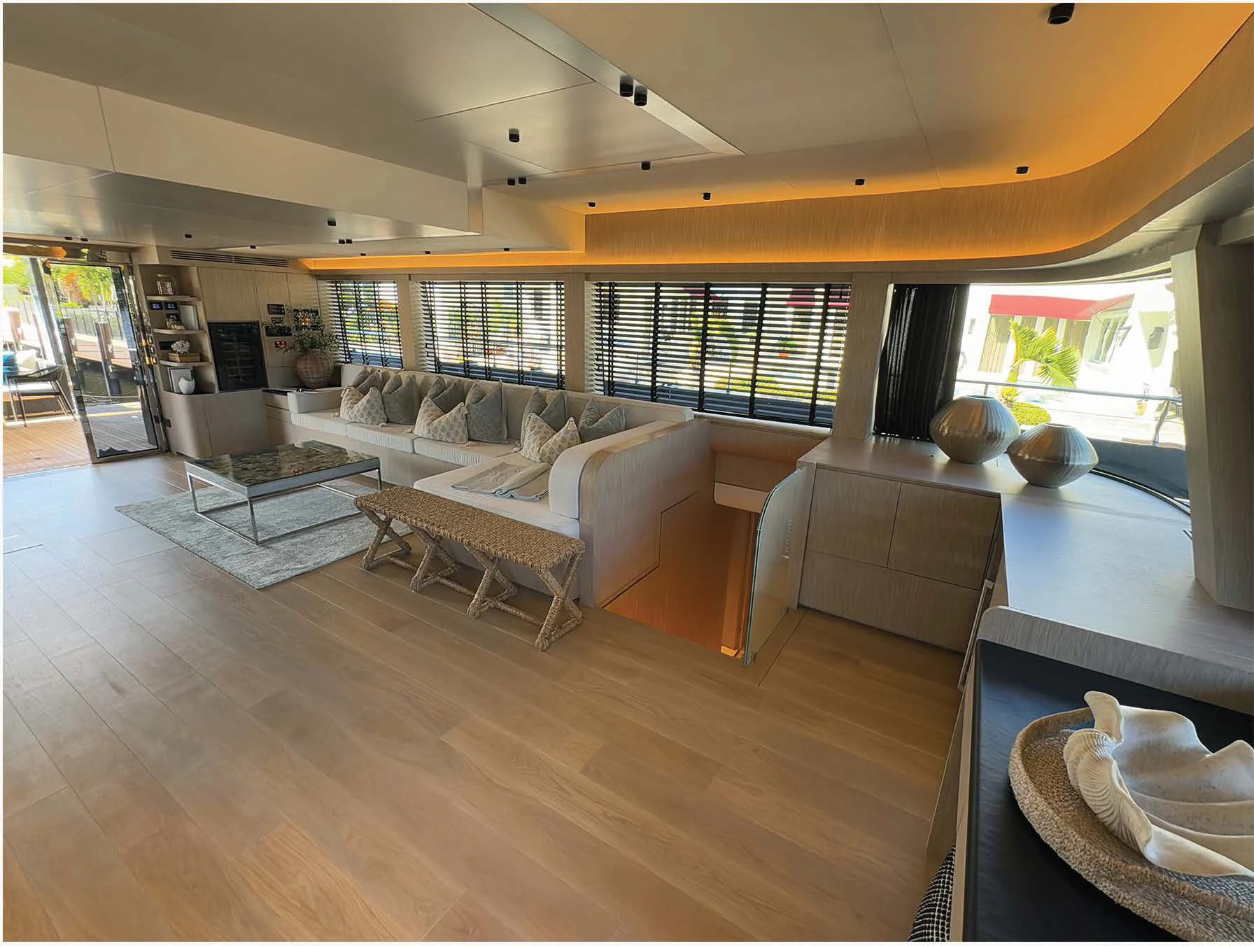 a living room with a large window aboard FLAGSHIP Yacht for Sale