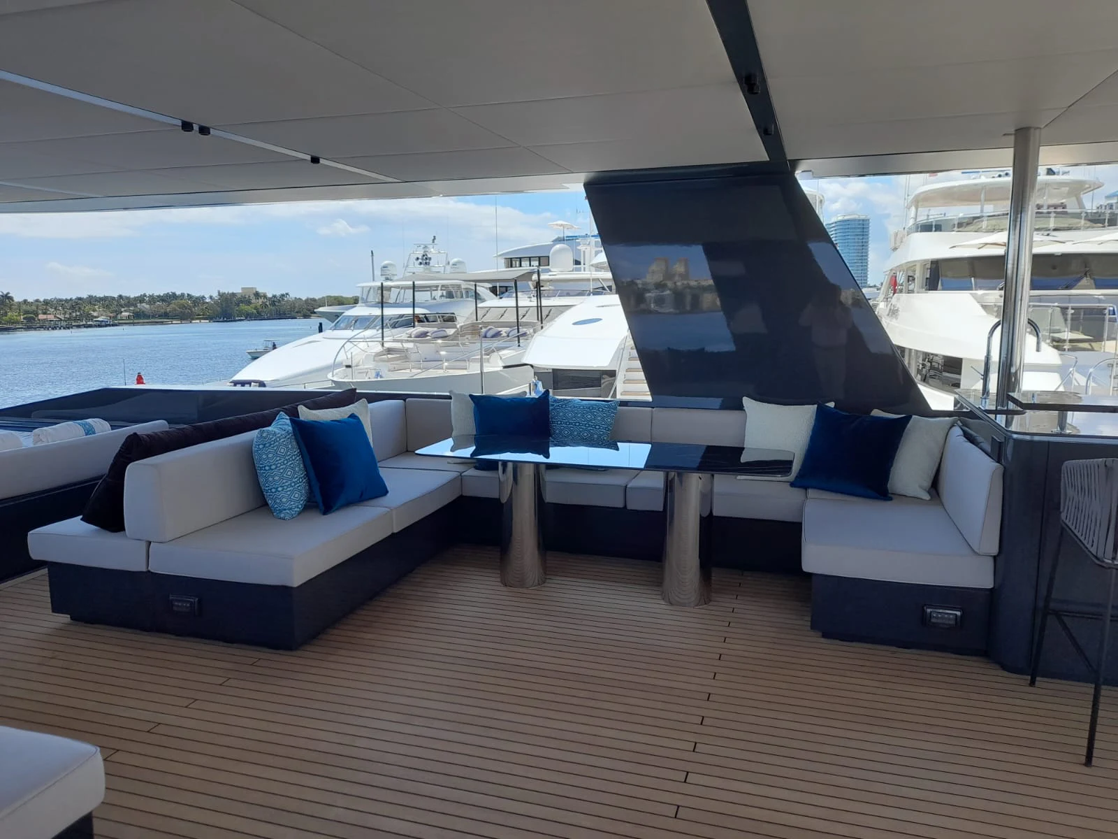 a large living room with a large balcony overlooking a large body of water aboard FLAGSHIP Yacht for Sale