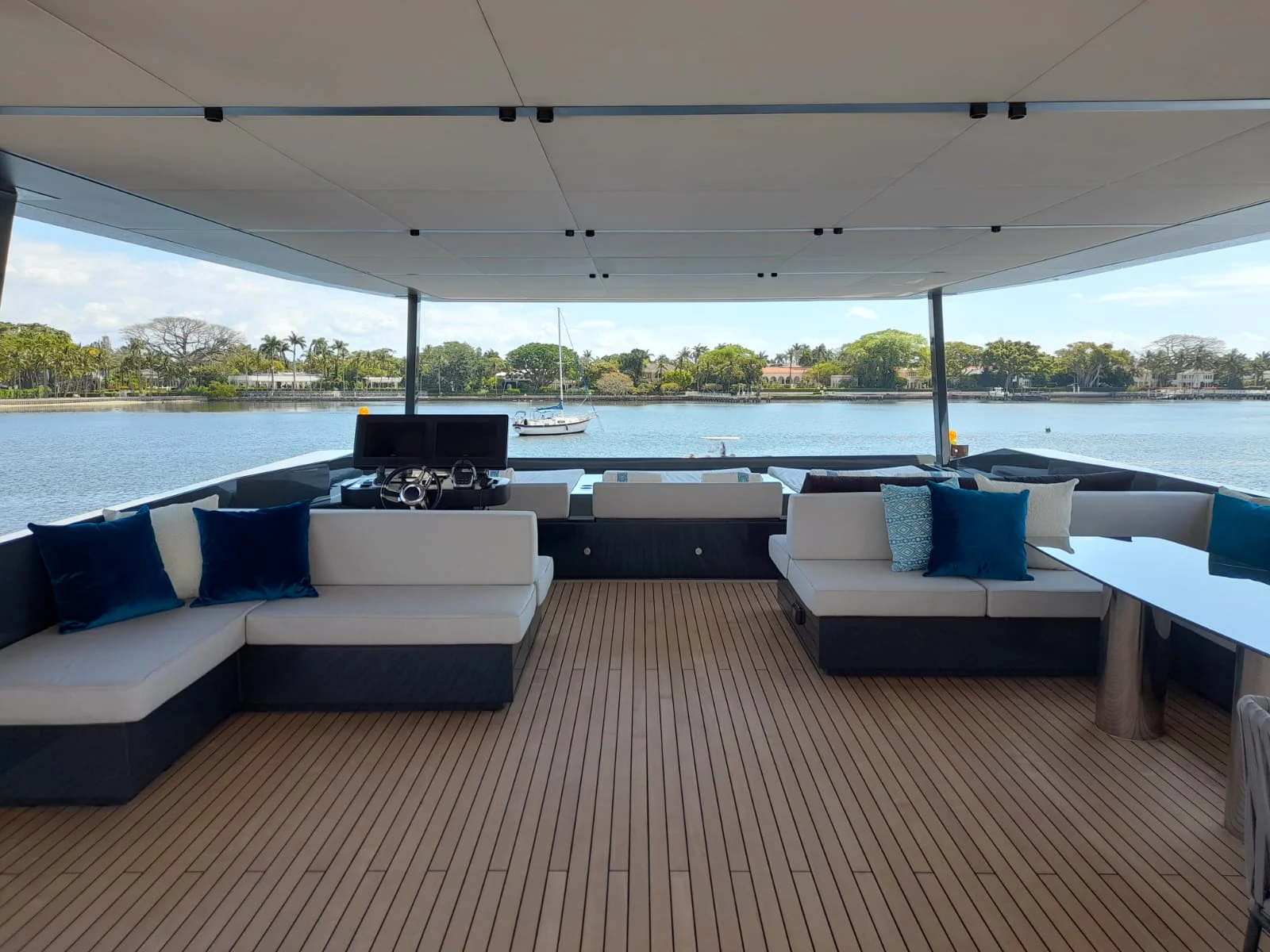 a large living room with a large deck and a large body of water aboard FLAGSHIP Yacht for Sale