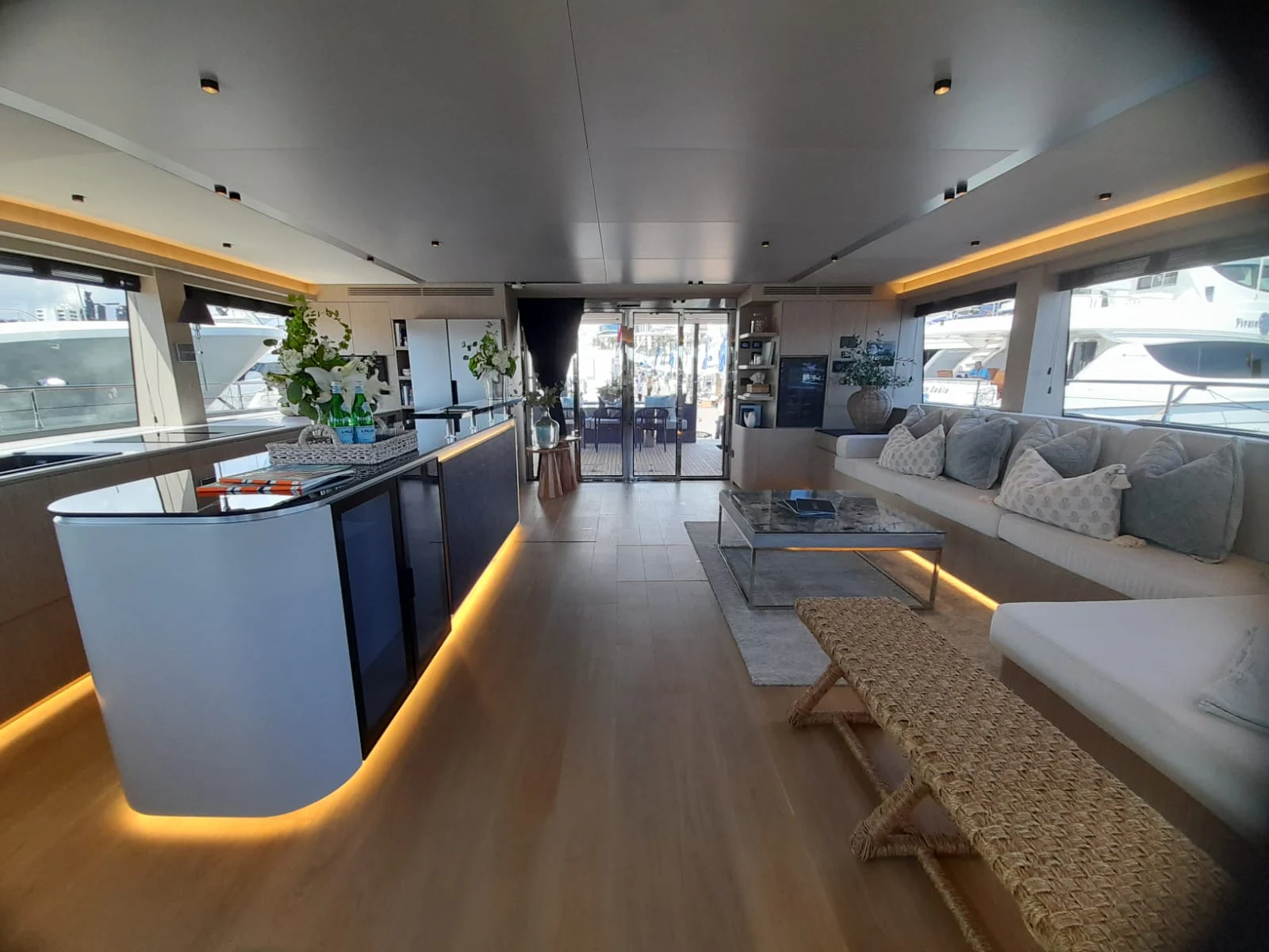 a living room with a large window aboard FLAGSHIP Yacht for Sale