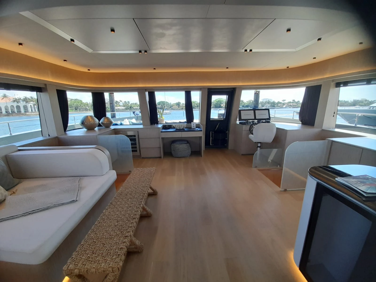 a living room with a large window aboard FLAGSHIP Yacht for Sale