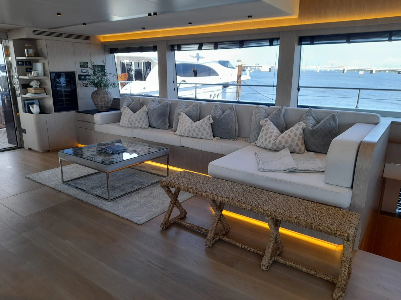 a living room with a large window aboard FLAGSHIP Yacht for Sale