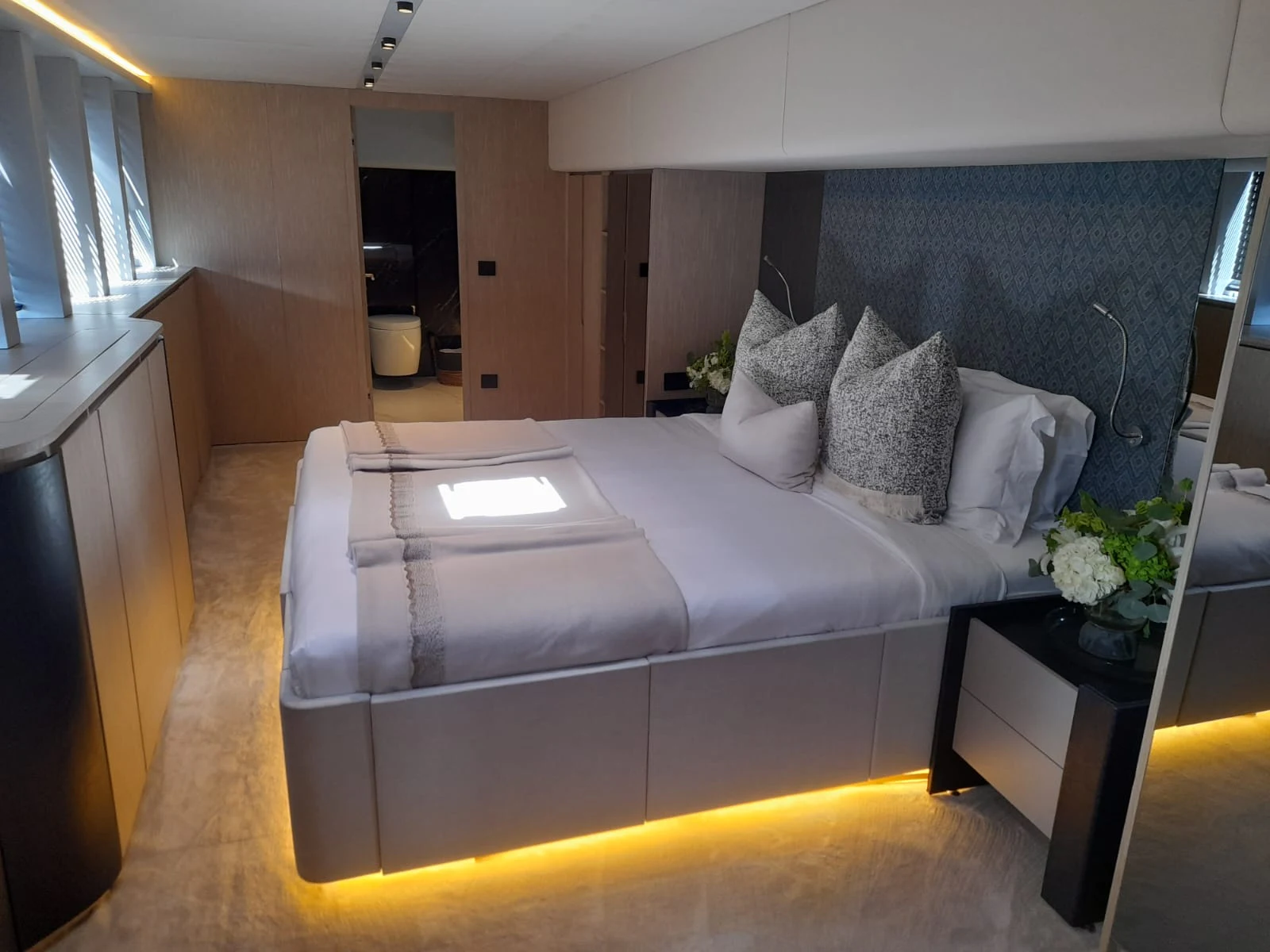 a white couch in a room aboard FLAGSHIP Yacht for Sale