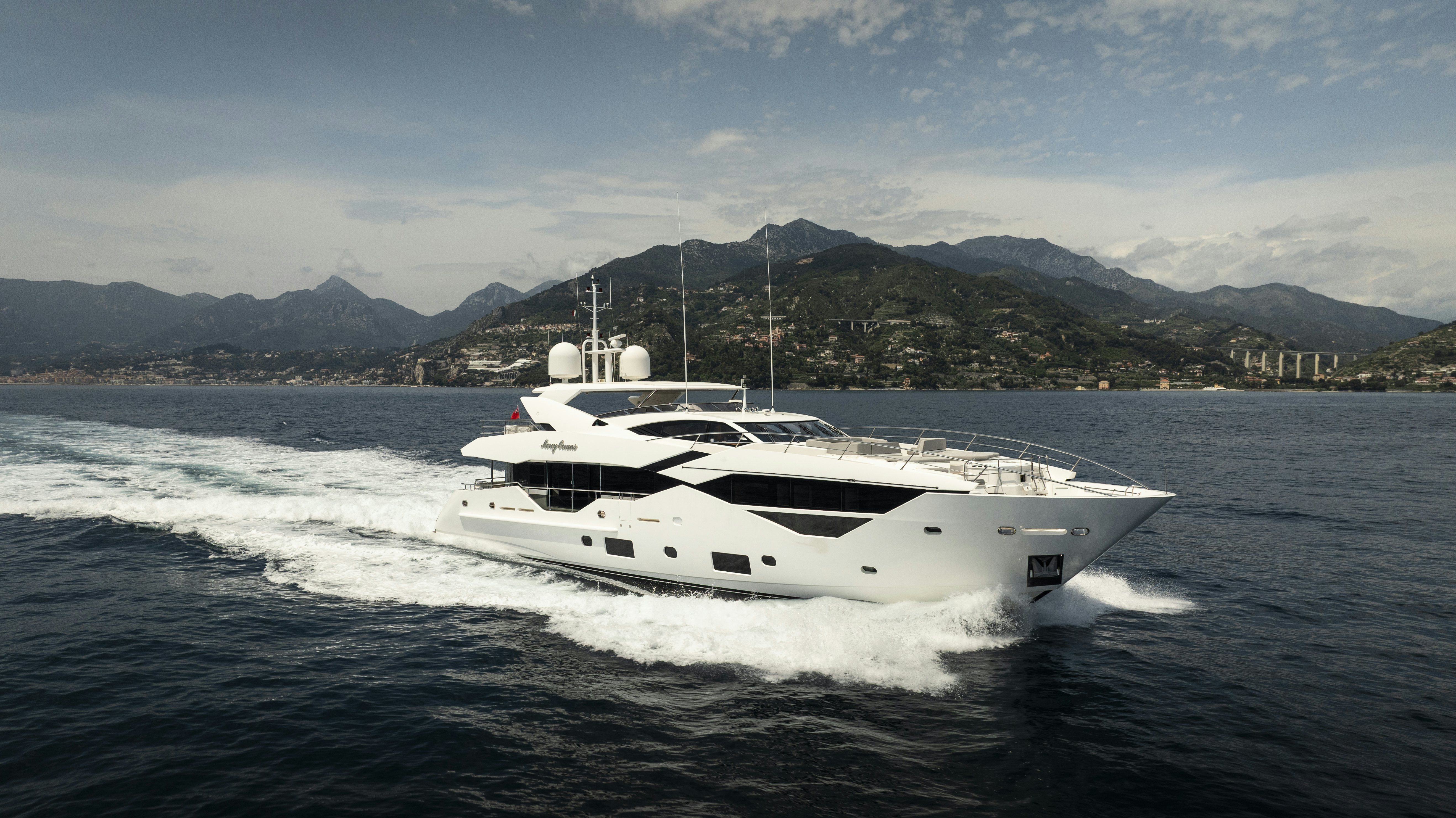 a white yacht on the water aboard MERCY OCEANS Yacht for Sale