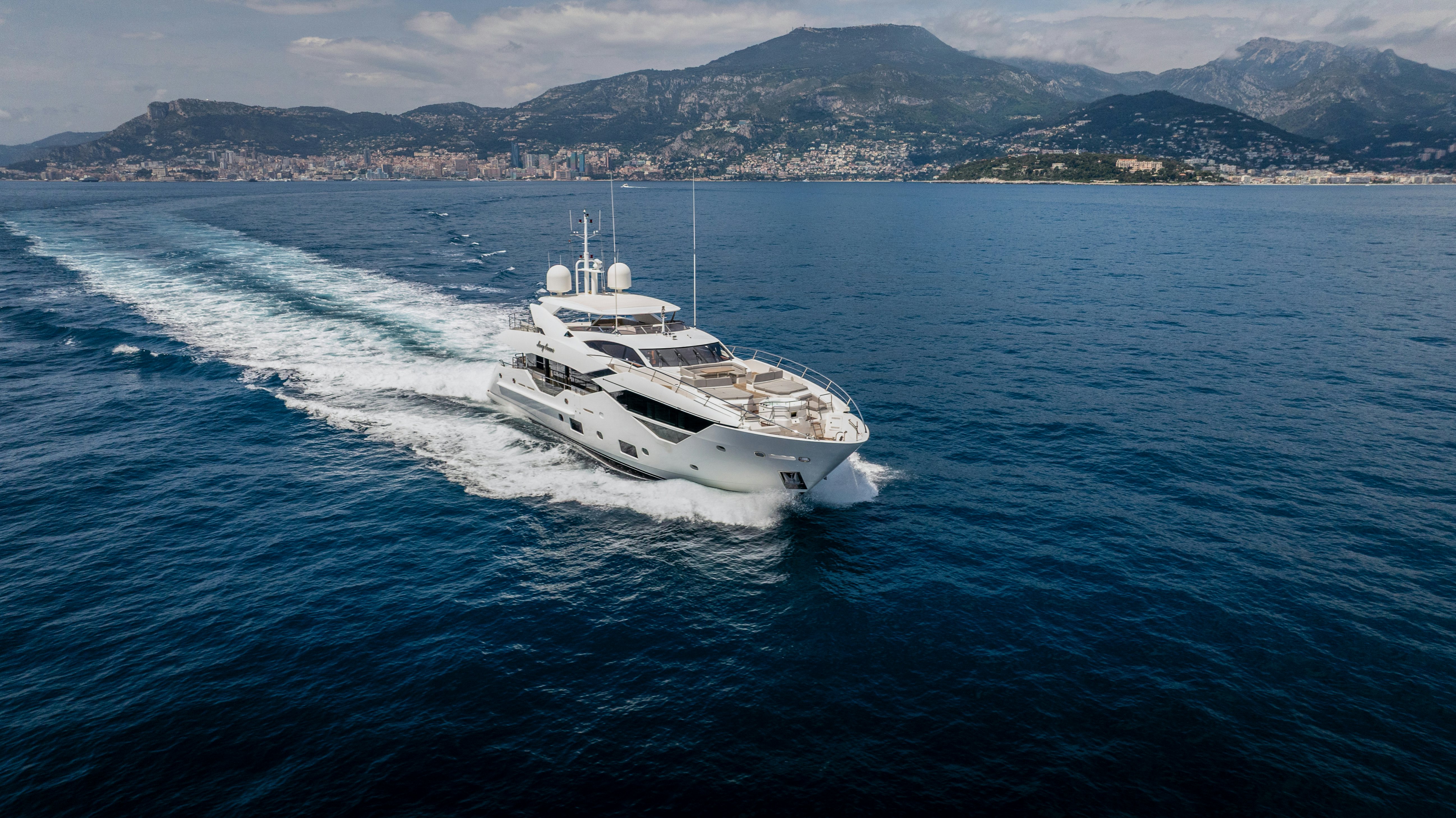 a white boat on the water aboard MERCY OCEANS Yacht for Sale