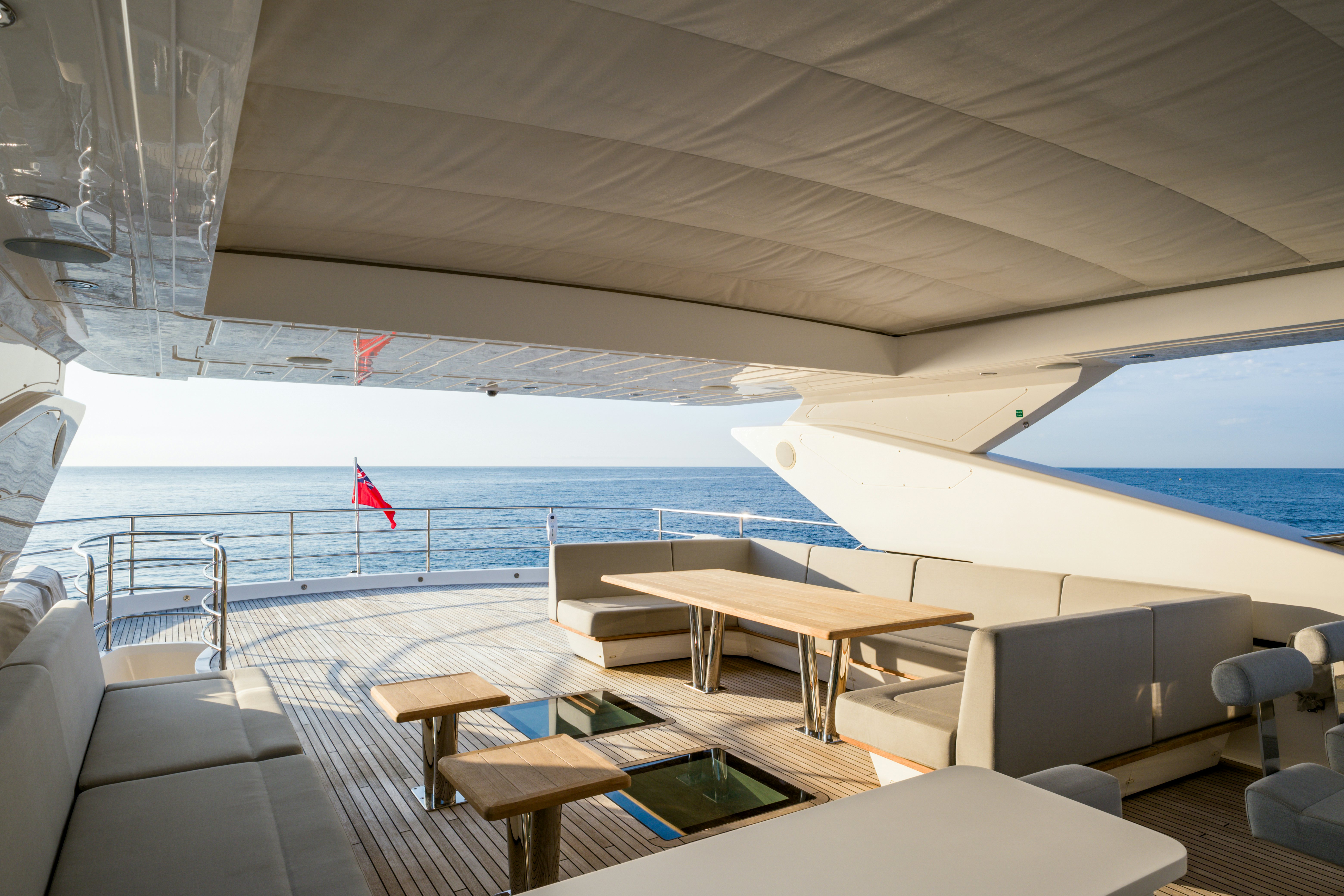 a boat with a table and chairs aboard MERCY OCEANS Yacht for Sale