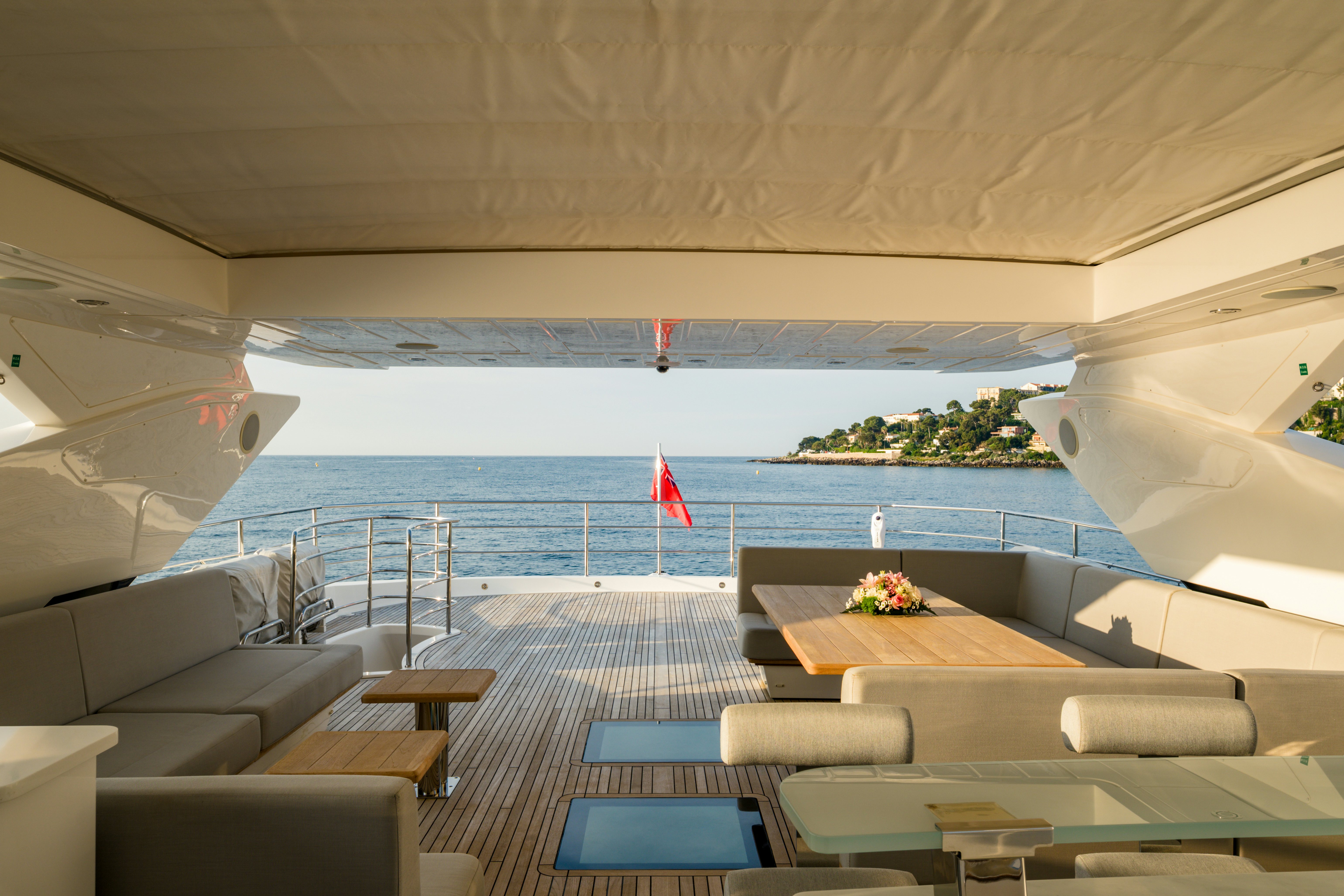 a room with a view of the ocean and a beach aboard MERCY OCEANS Yacht for Sale