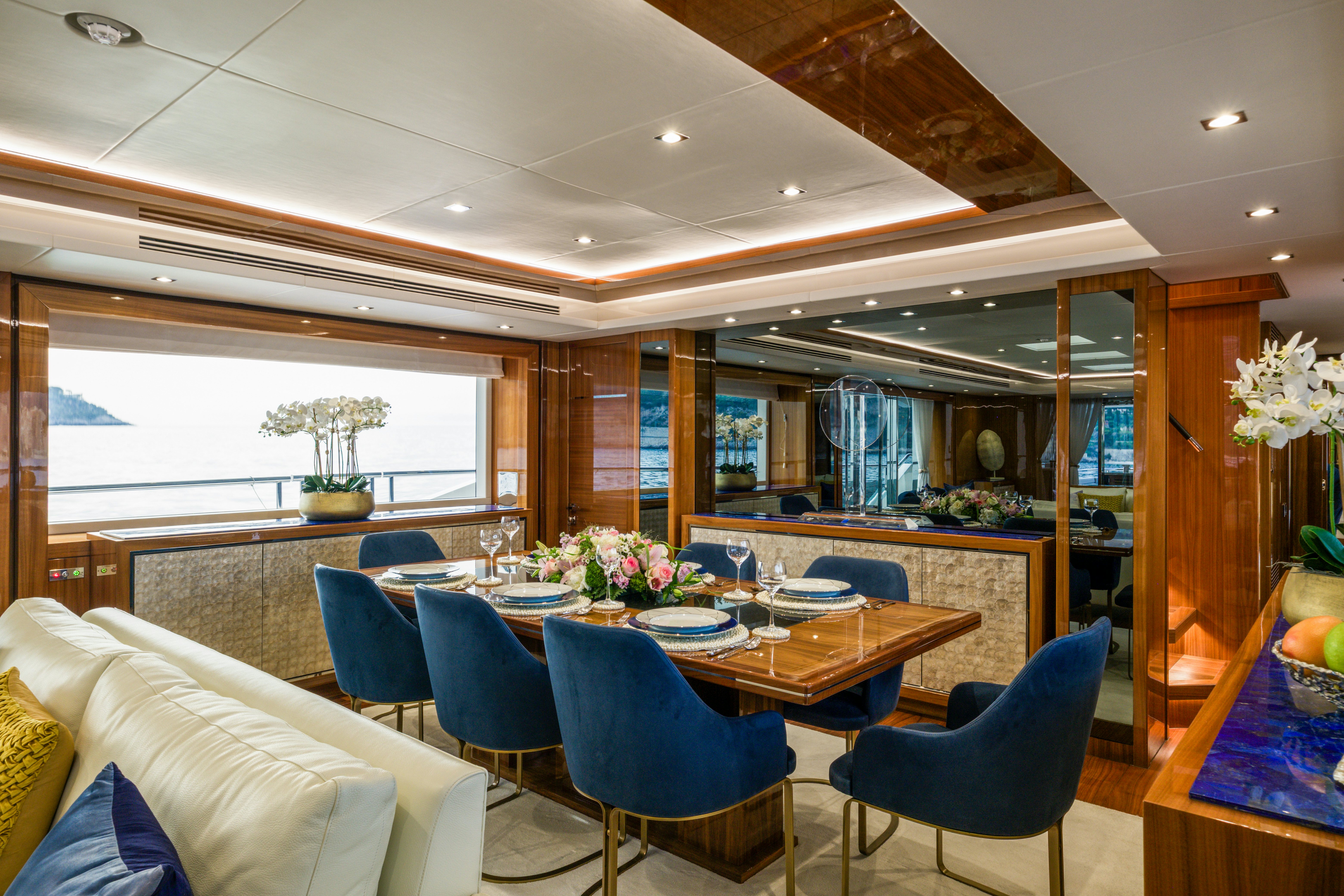 a room with a table chairs and a window aboard MERCY OCEANS Yacht for Sale
