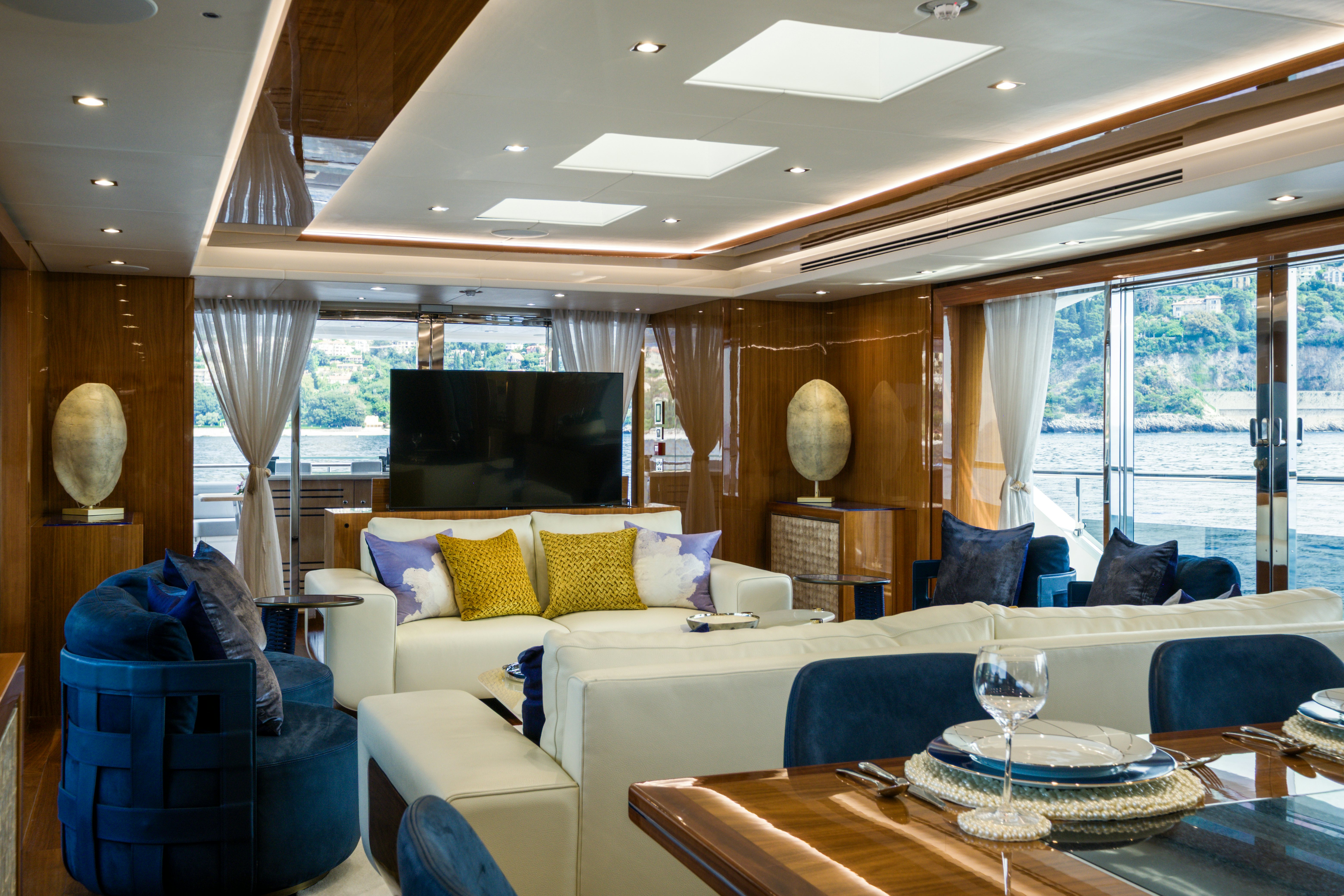 a living room with a large window aboard MERCY OCEANS Yacht for Sale