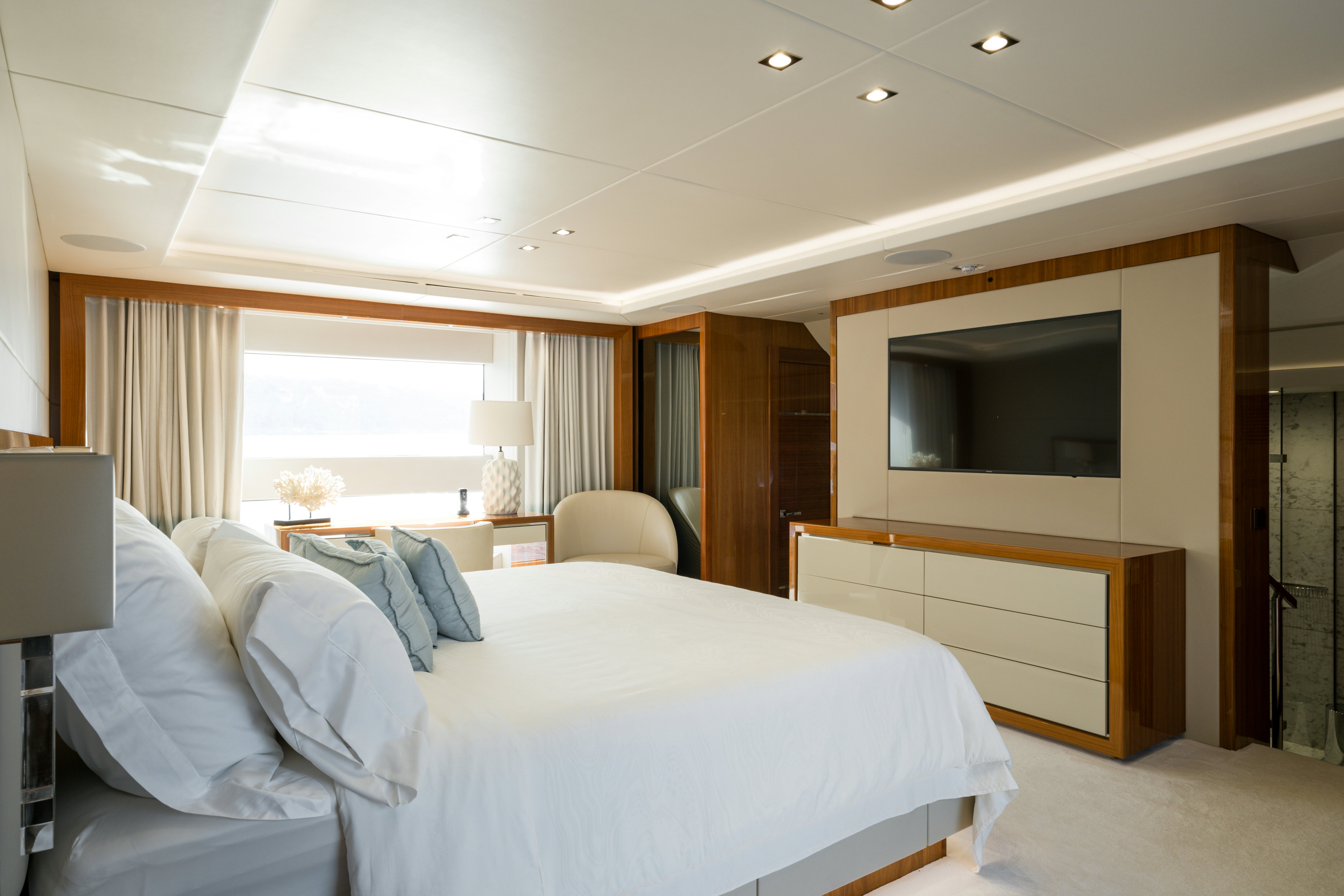 a room with a bed and a television aboard MERCY OCEANS Yacht for Sale