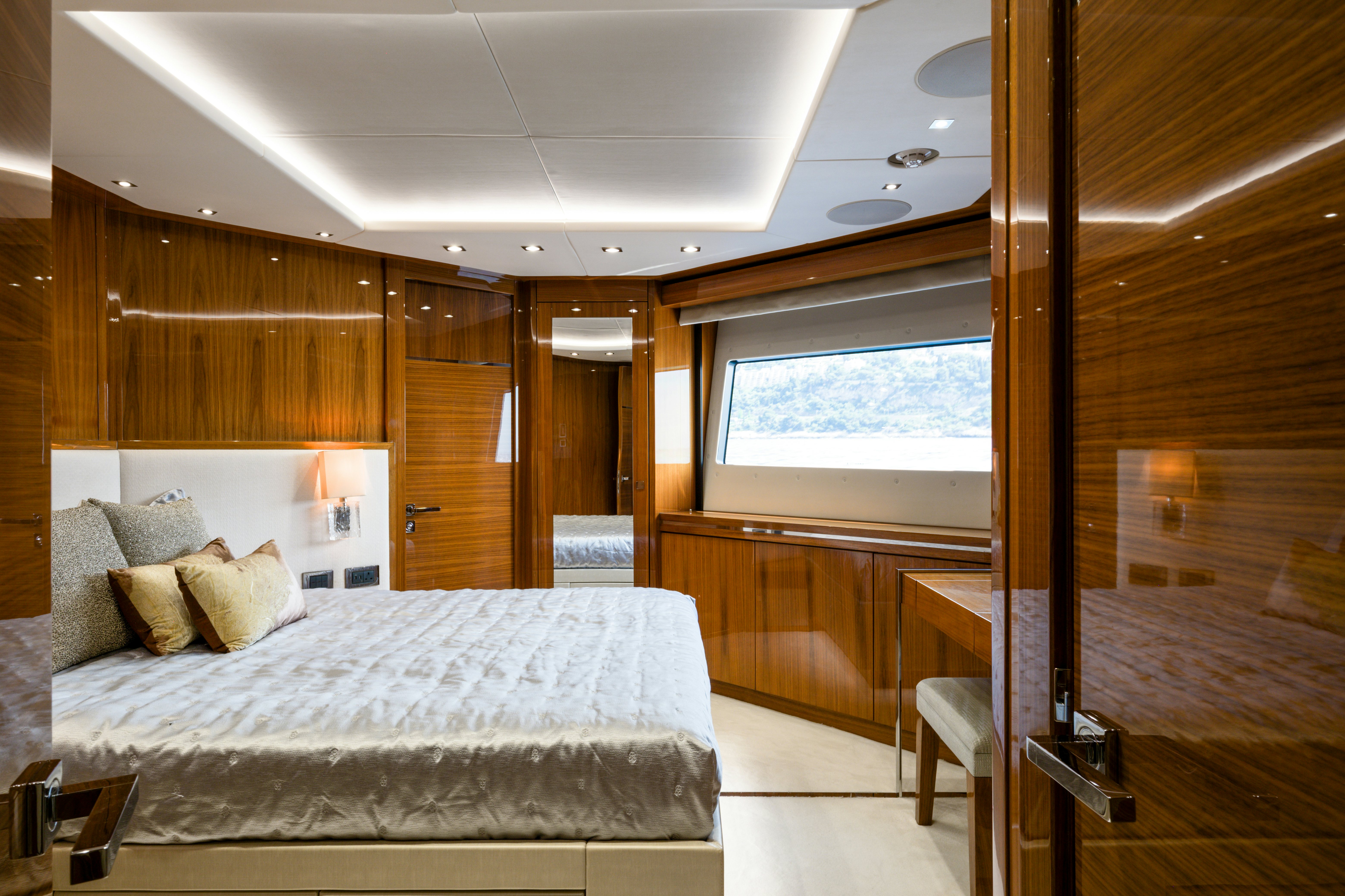 a large bedroom with a large bed aboard MERCY OCEANS Yacht for Sale