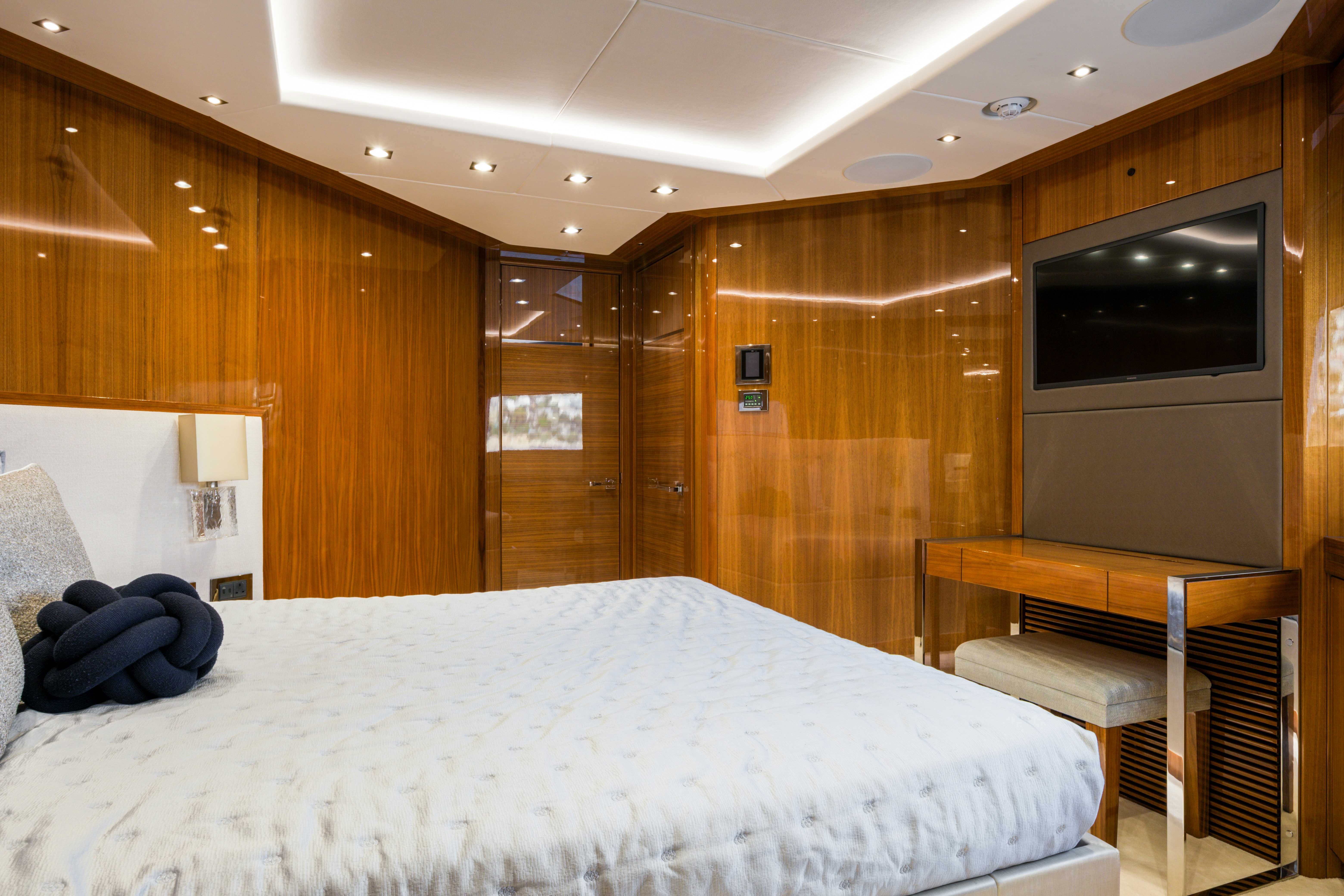 a room with a bed and a television aboard MERCY OCEANS Yacht for Sale