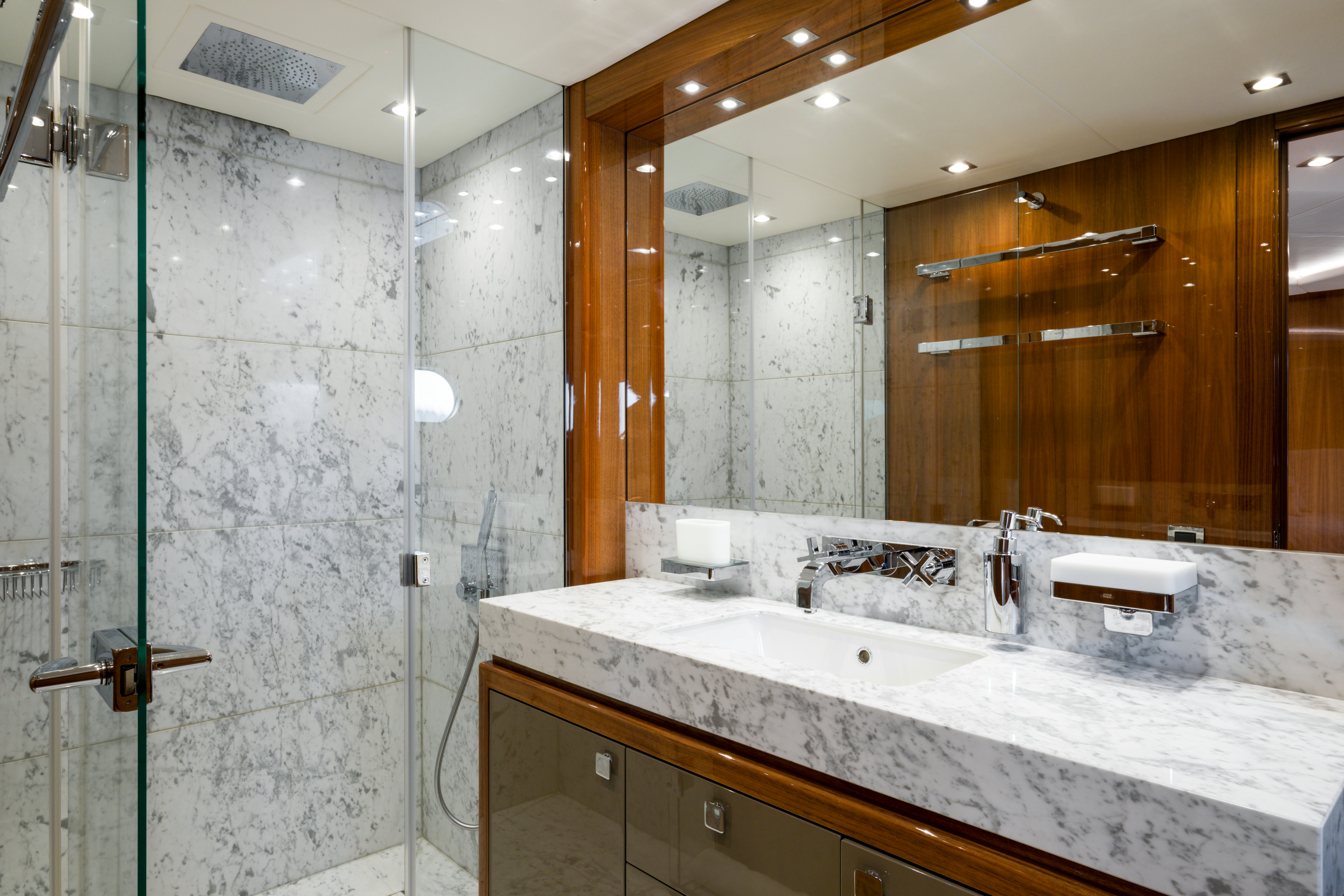 a bathroom with a large mirror aboard MERCY OCEANS Yacht for Sale