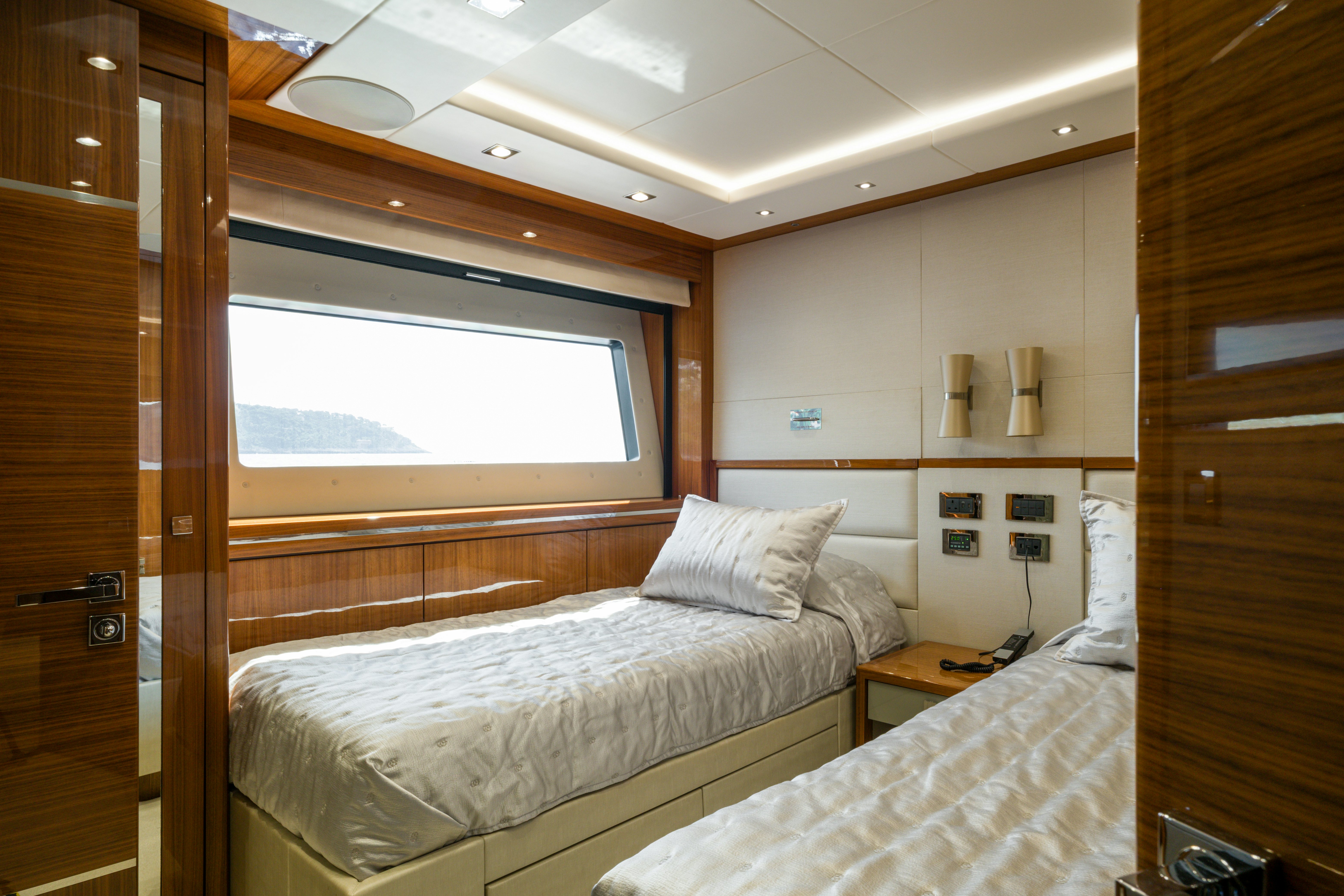 a room with two beds aboard MERCY OCEANS Yacht for Sale