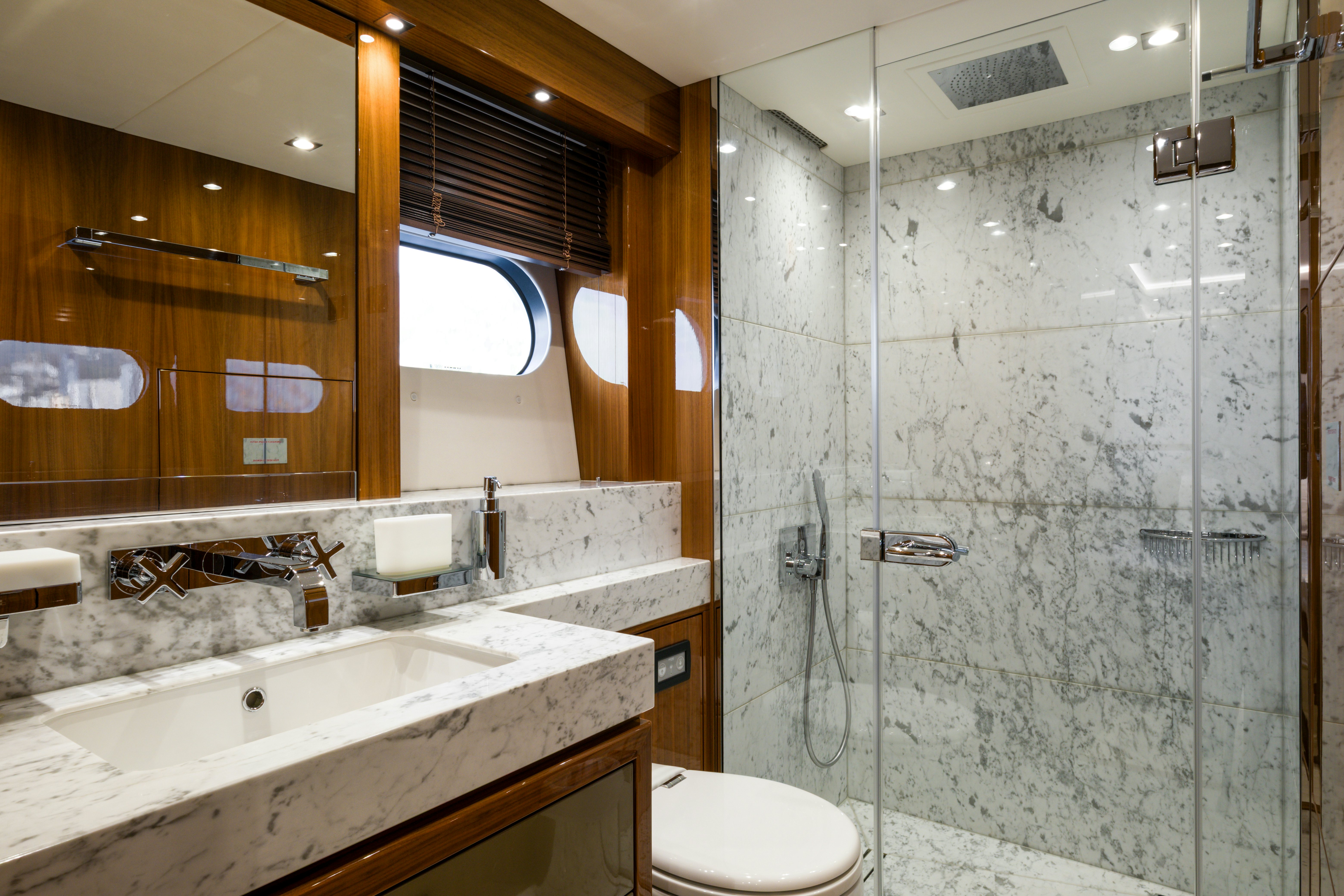 a bathroom with a glass shower aboard MERCY OCEANS Yacht for Sale