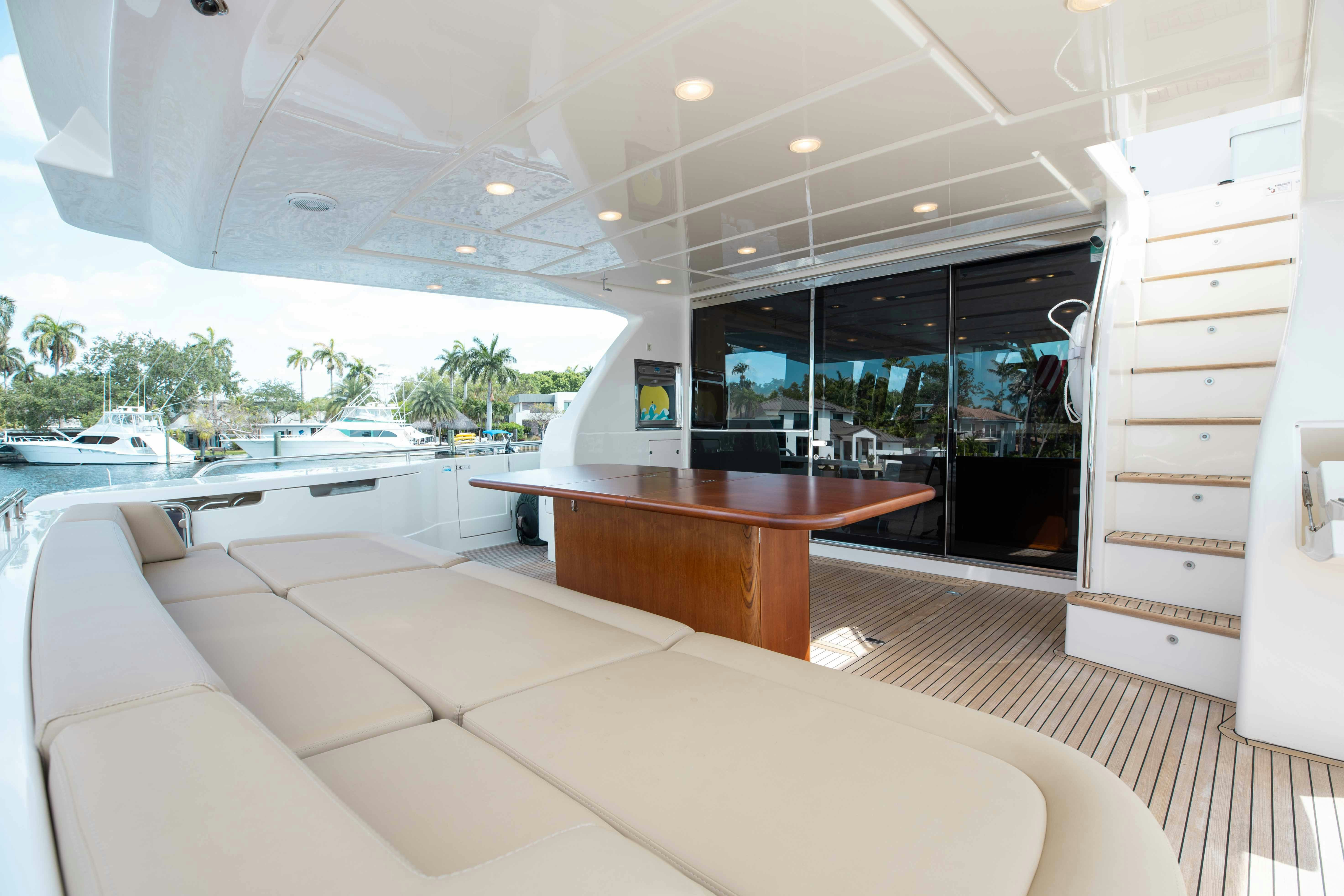 a room with a couch and a table aboard LIVING LIFE 3 Yacht for Sale