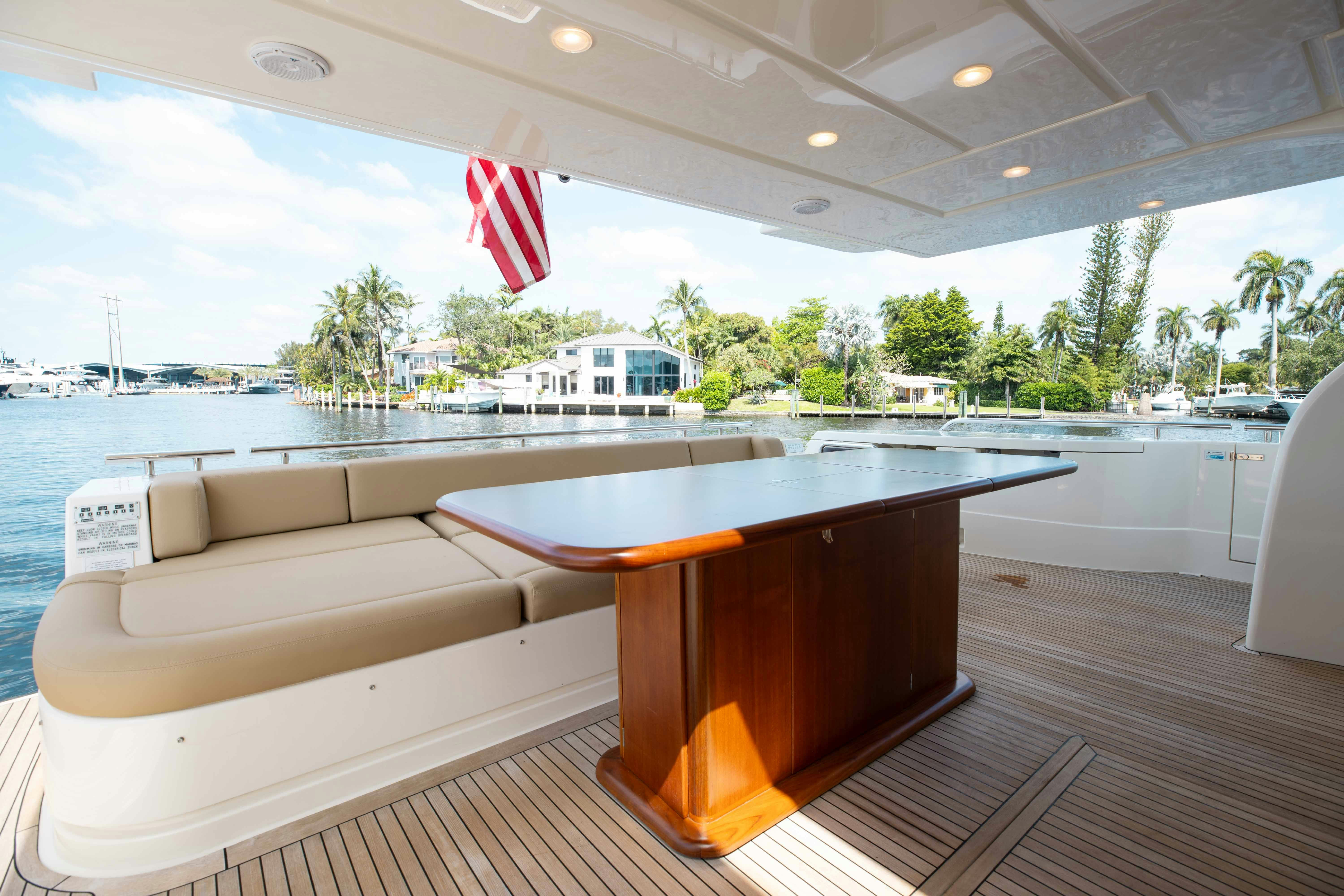 a table on a deck aboard LIVING LIFE 3 Yacht for Sale