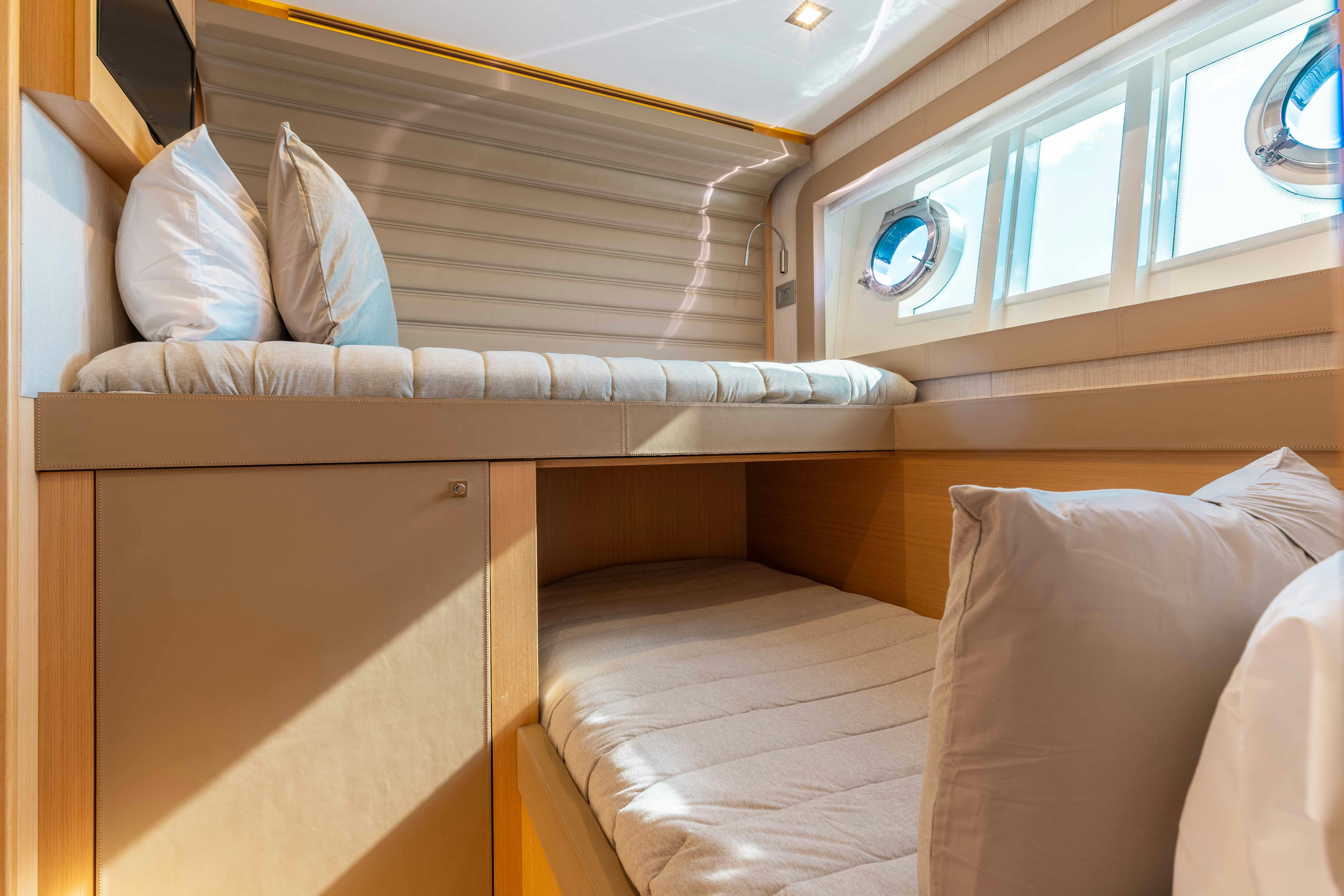 a bed in a room aboard LIVING LIFE 3 Yacht for Sale