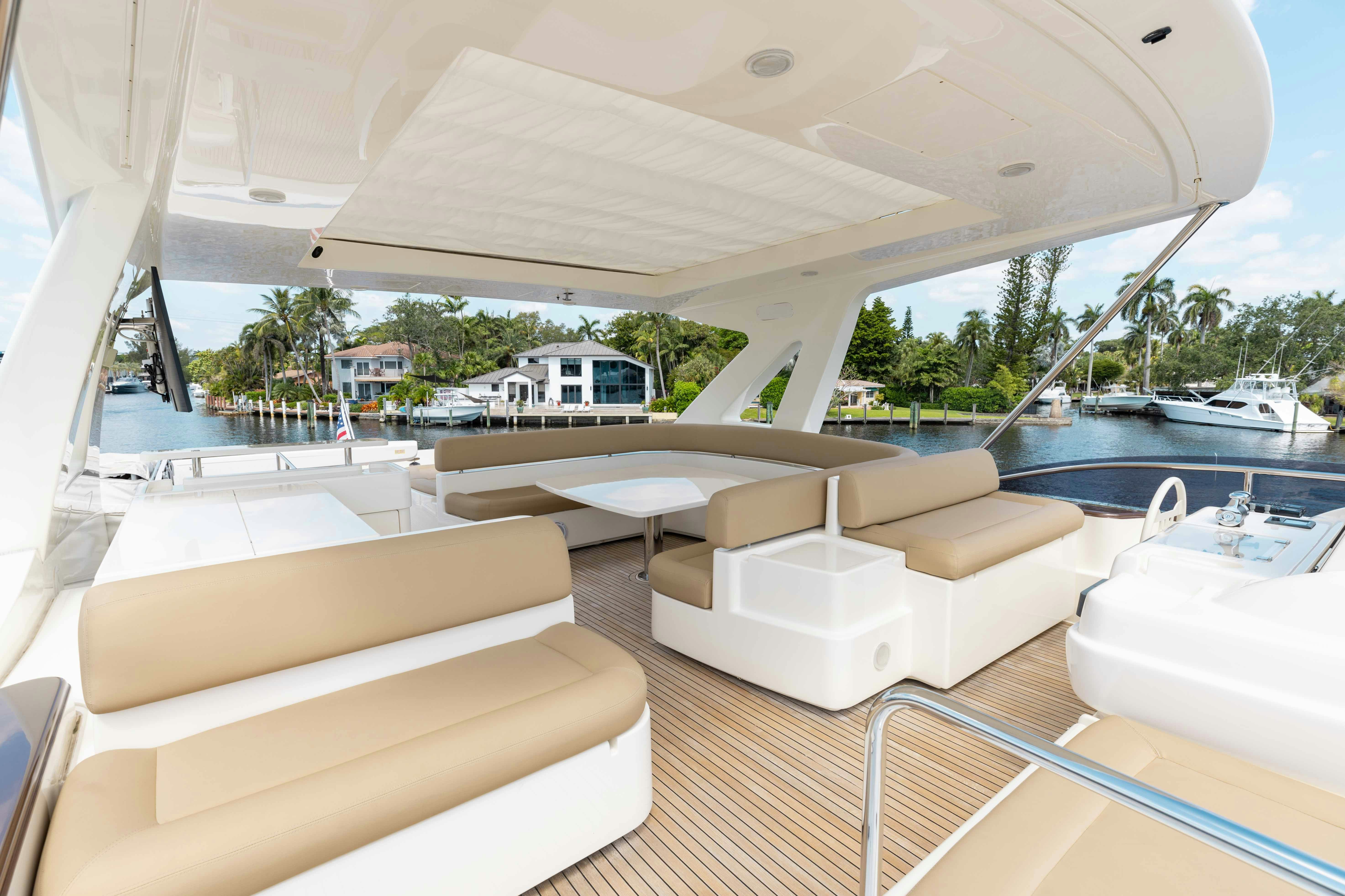 a room with a couch and a pool aboard LIVING LIFE 3 Yacht for Sale