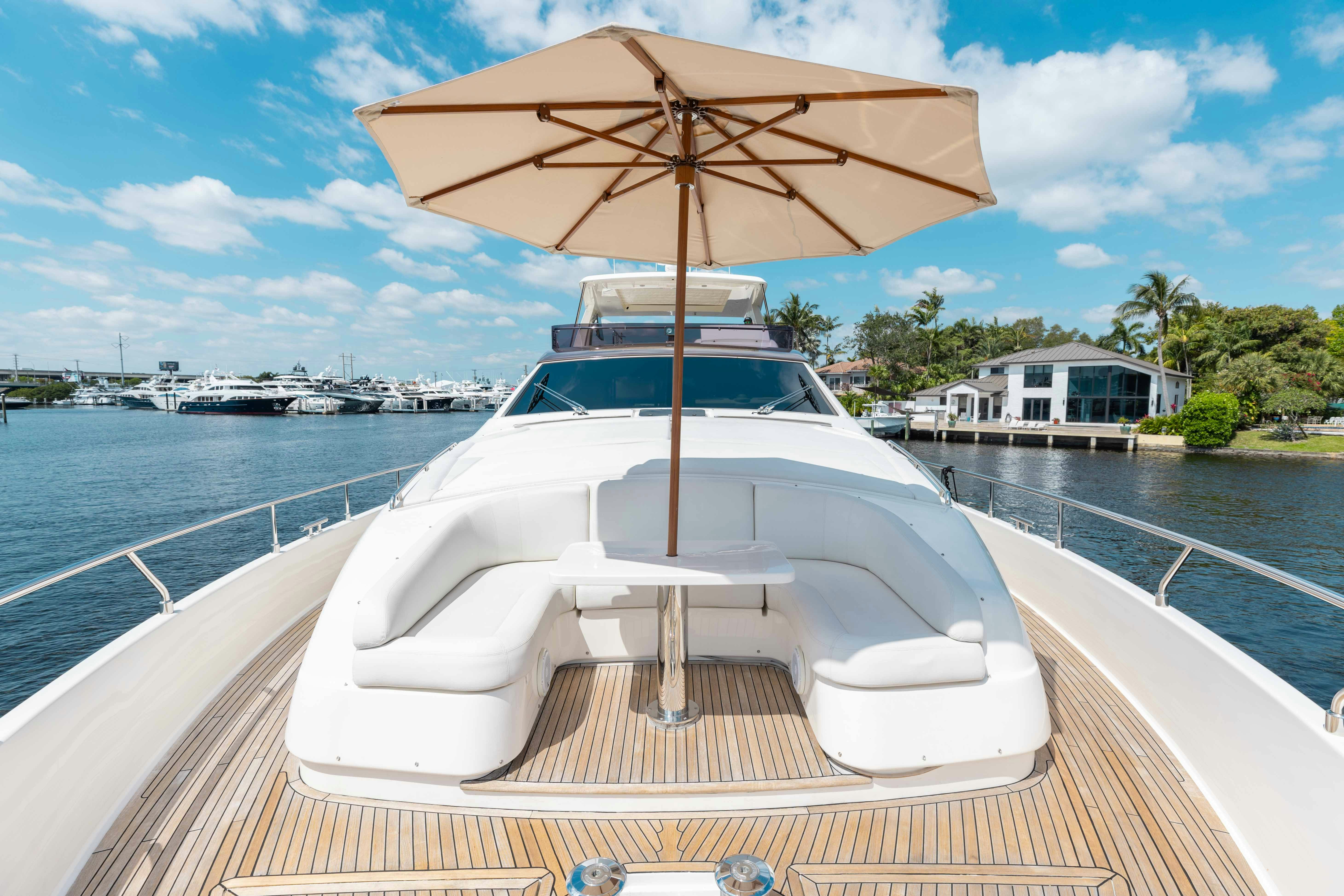 a boat with an umbrella on it aboard LIVING LIFE 3 Yacht for Sale