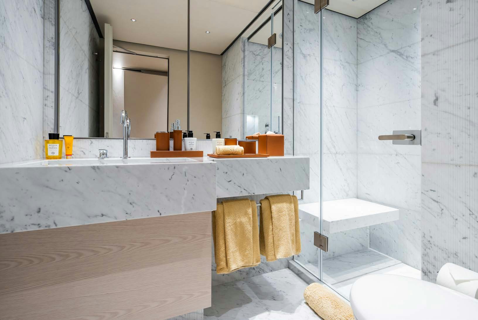 a bathroom with a large mirror aboard R.M.F Yacht for Charter