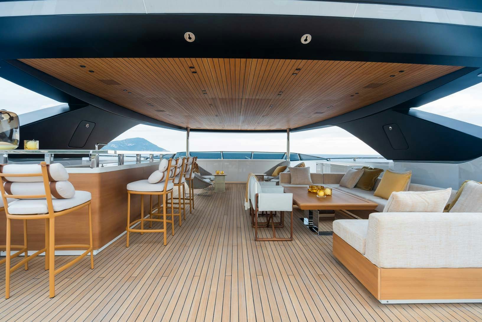 a room with a couch and a table and chairs aboard R.M.F Yacht for Charter