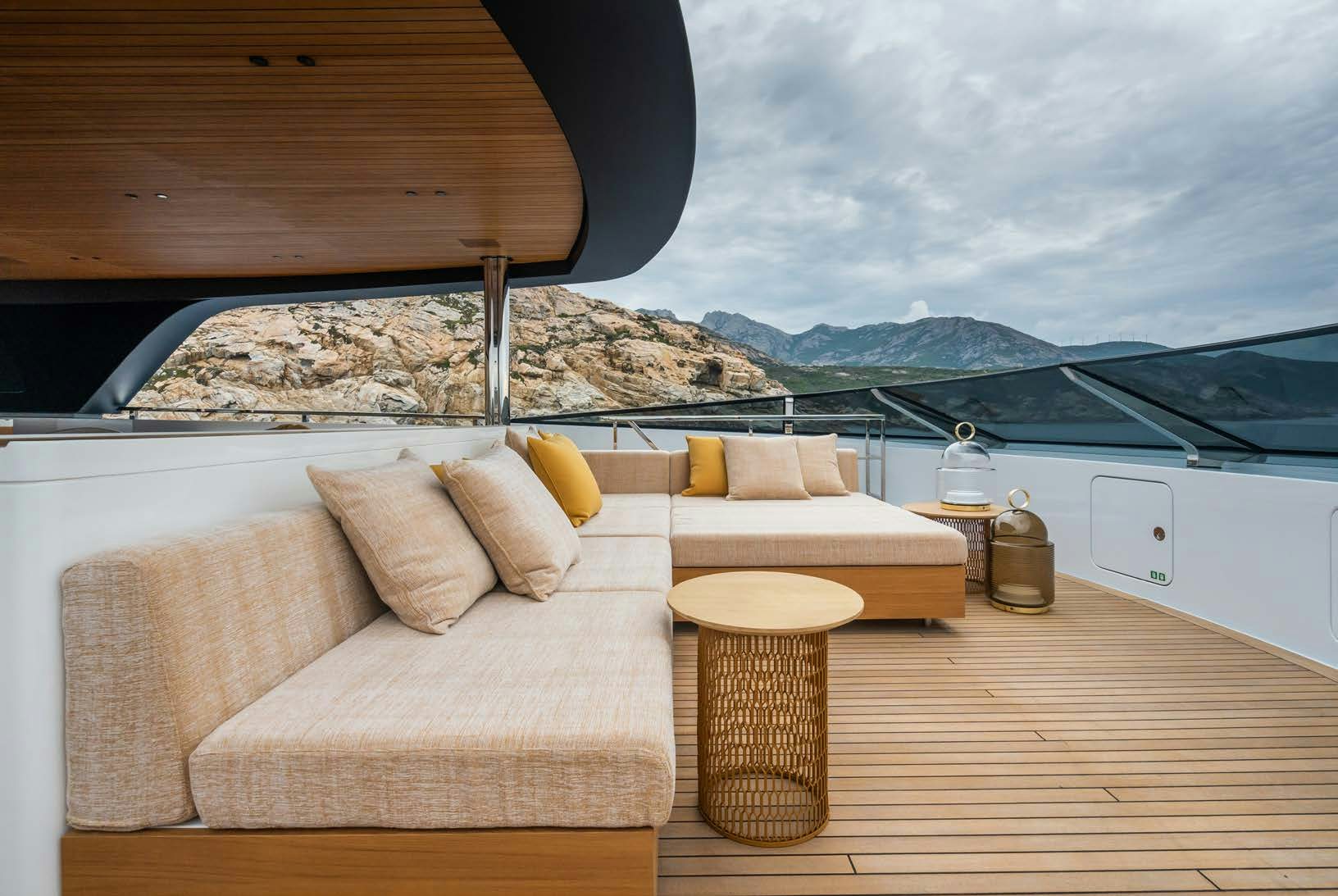 a room with a bed and a table with pillows on it aboard R.M.F Yacht for Charter