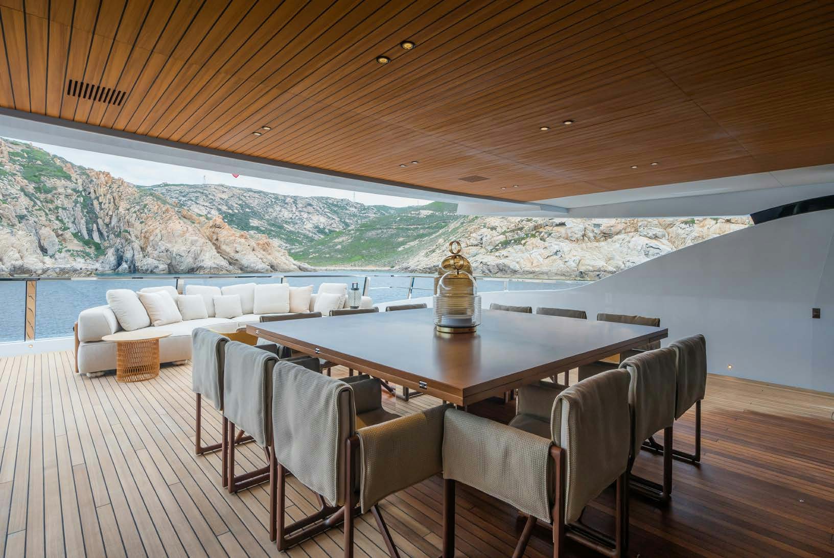 a table and chairs on a deck aboard R.M.F Yacht for Charter