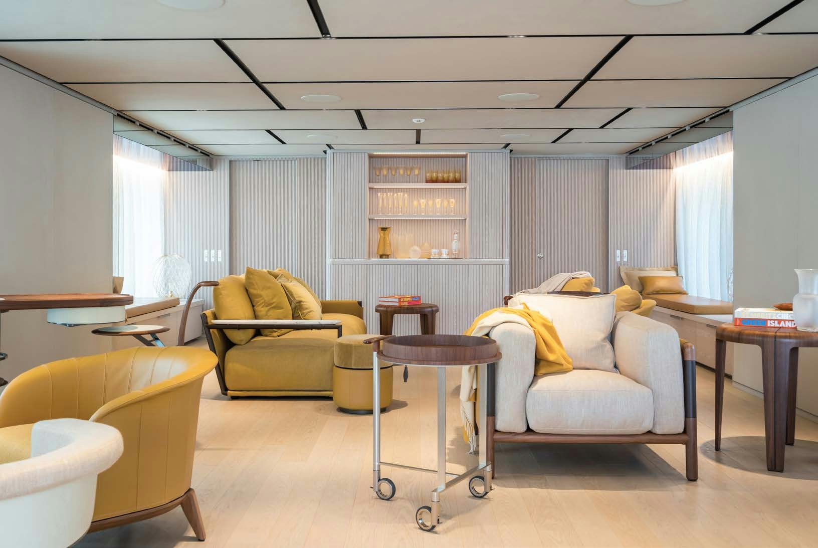 a living room with a table and chairs aboard R.M.F Yacht for Charter