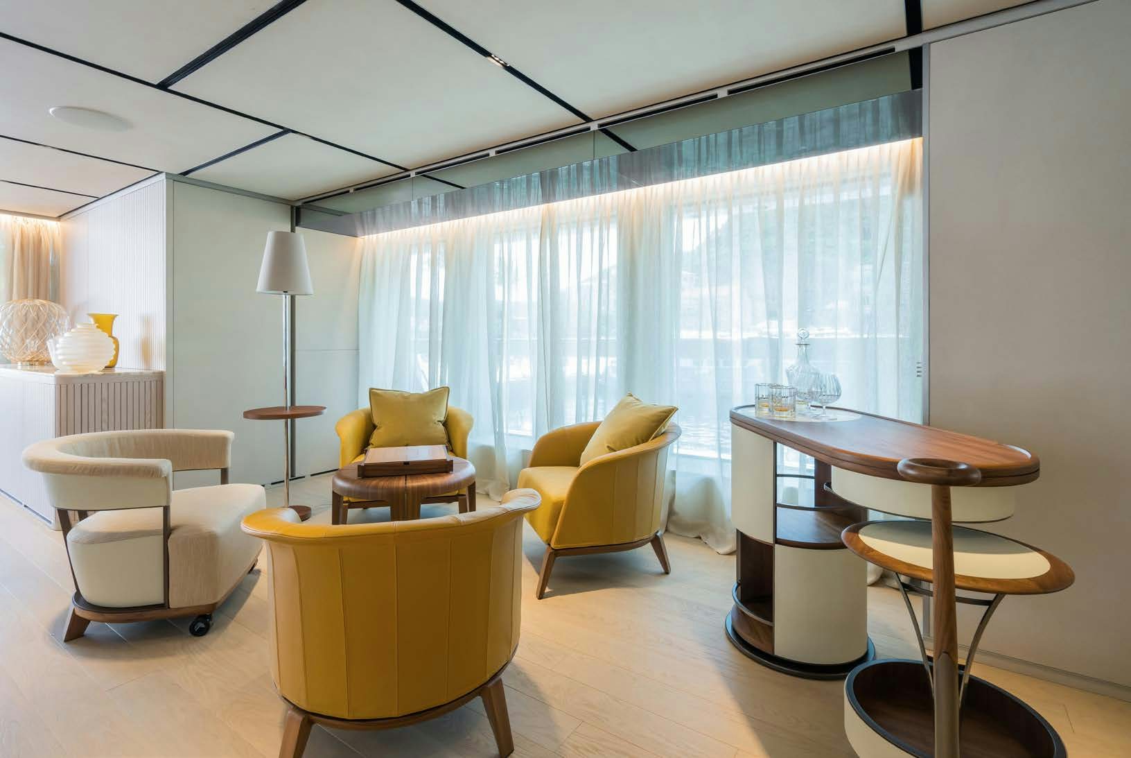 a living room with a table and chairs aboard R.M.F Yacht for Charter