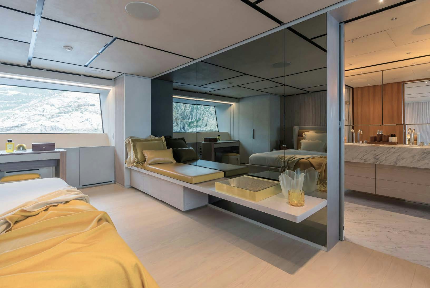 a room with a bed and a couch aboard R.M.F Yacht for Charter