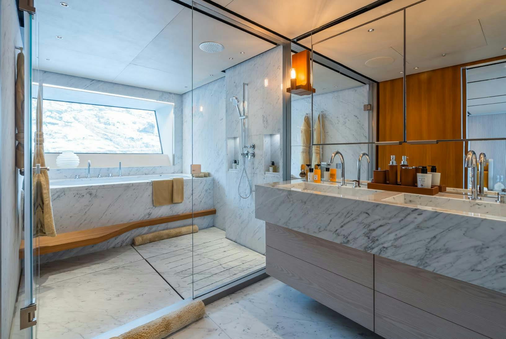 a large kitchen with a large marble counter top aboard R.M.F Yacht for Charter