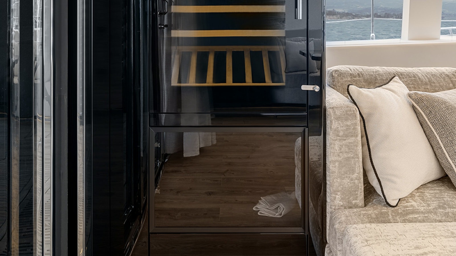 a room with a couch and a window aboard AMILEO Yacht for Charter