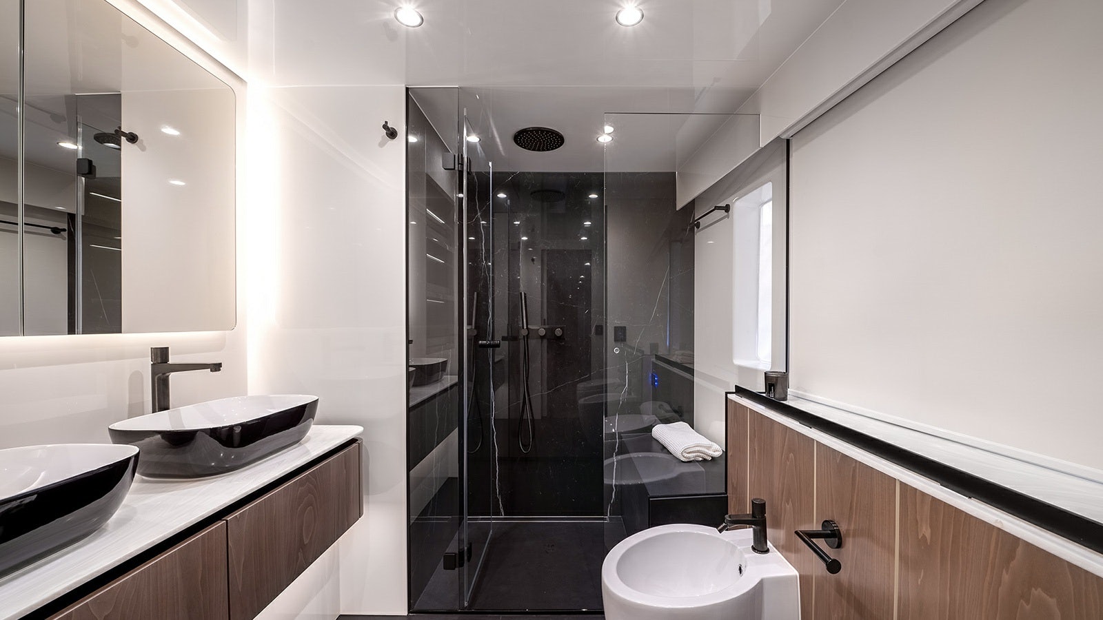 a bathroom with a shower and sinks aboard AMILEO Yacht for Charter