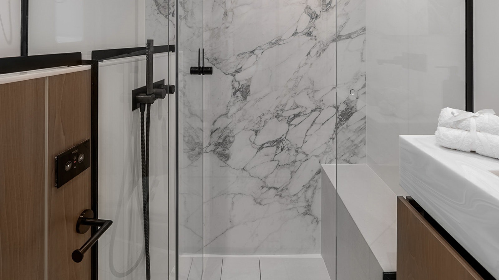 a shower with a glass door aboard AMILEO Yacht for Charter