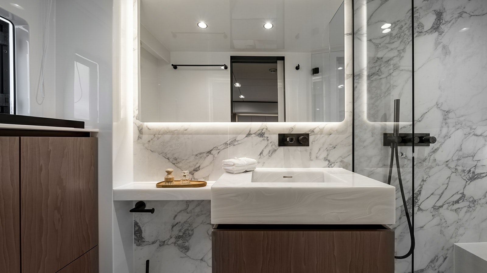 a bathroom with a sink and mirror aboard AMILEO Yacht for Charter